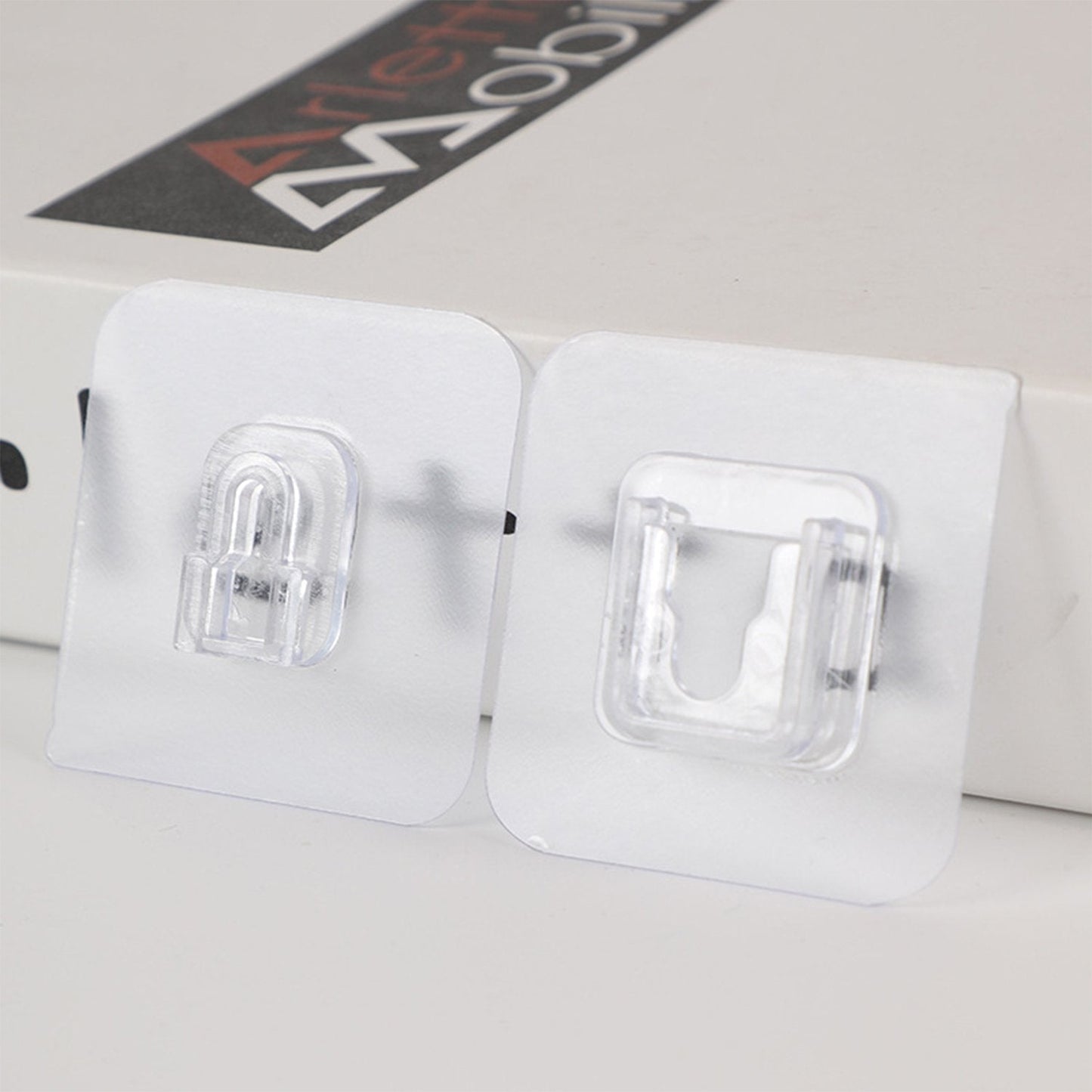 Multiple adhesive hooks displayed together, showcasing versatile use.