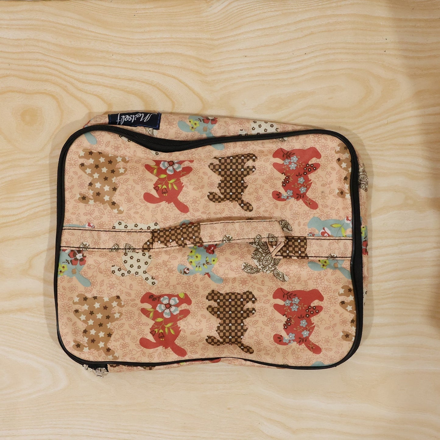 Person holding a compact travel organizer bag, ready for daily use.