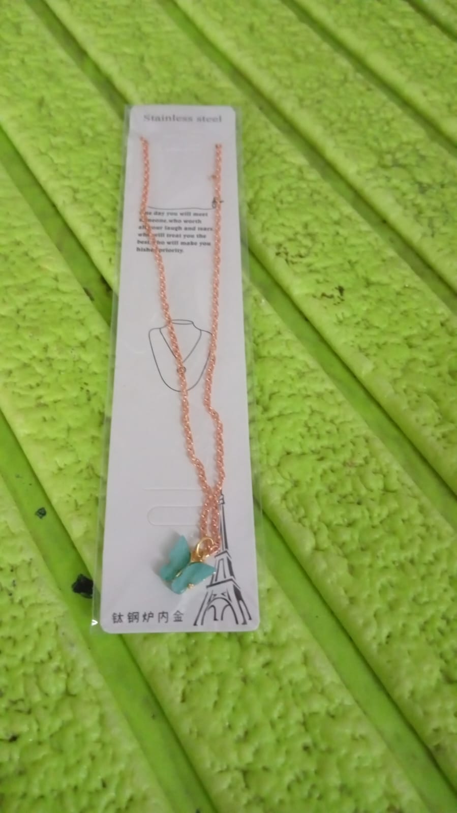Model wearing the fashionable charm chain necklace, perfect for gifting.