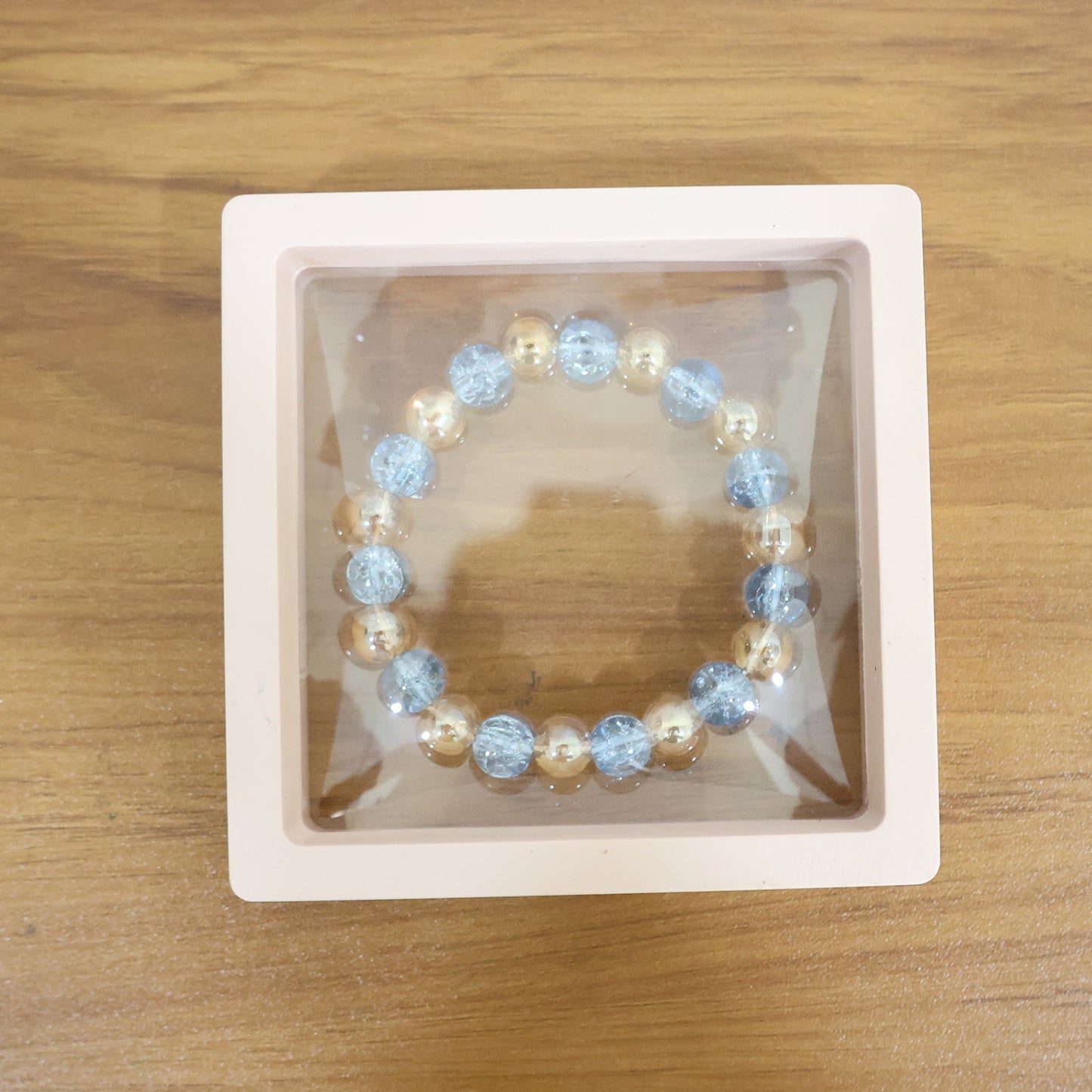 Live wrist view of elegant dual-tone crystal beaded stretch bracelet