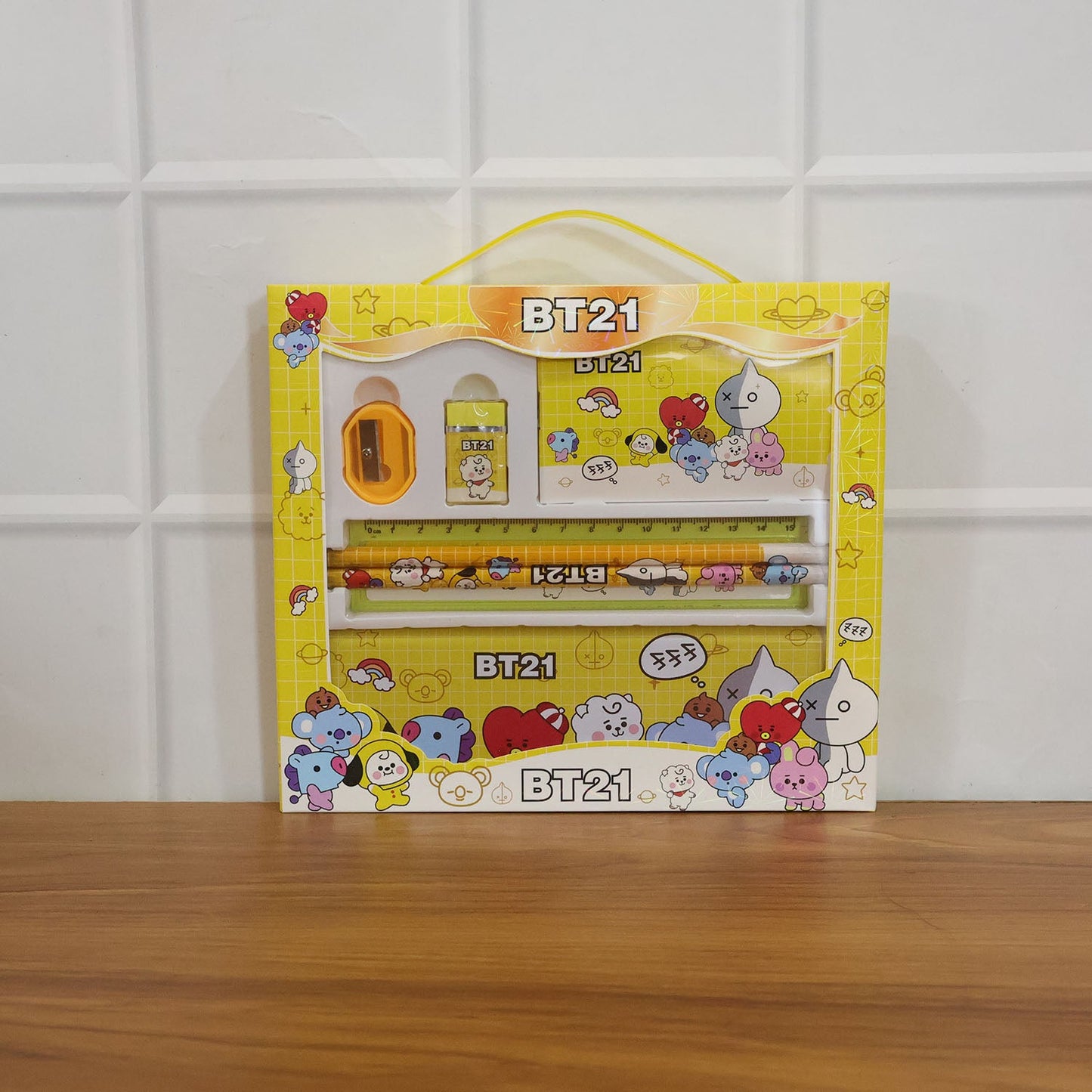 Kids using cartoon pencil box set with pencils, ruler and eraser during study