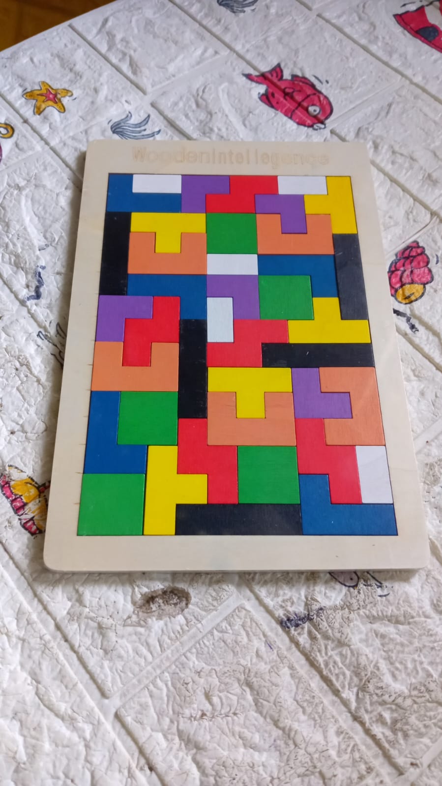 Abstract geometric pattern with colorful shapes, representing creative play possibilities.