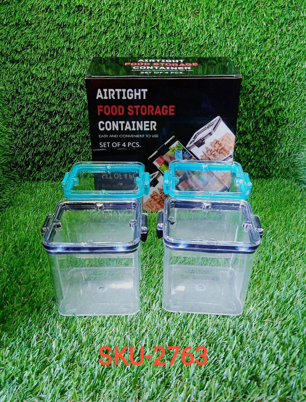 Four 700ml square containers arranged with food items, demonstrating practical kitchen storage.