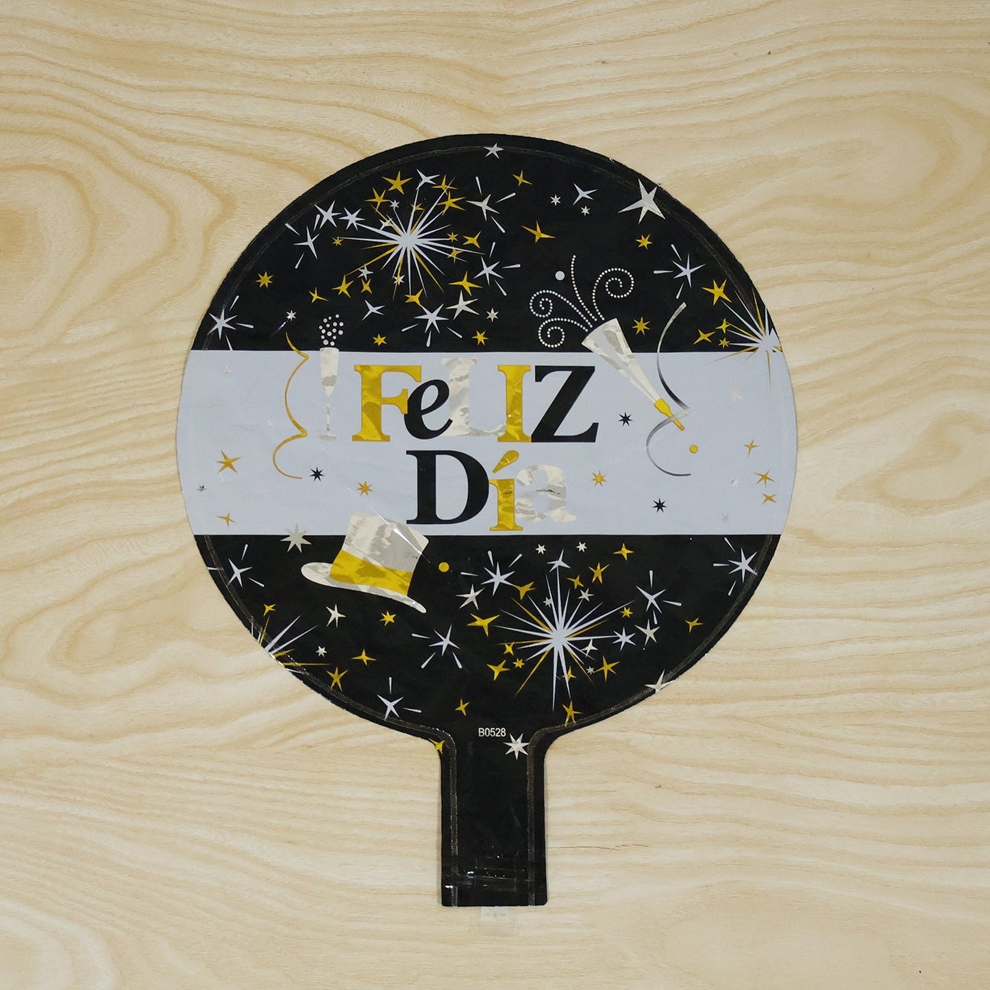 In-use black gold foil celebration balloon