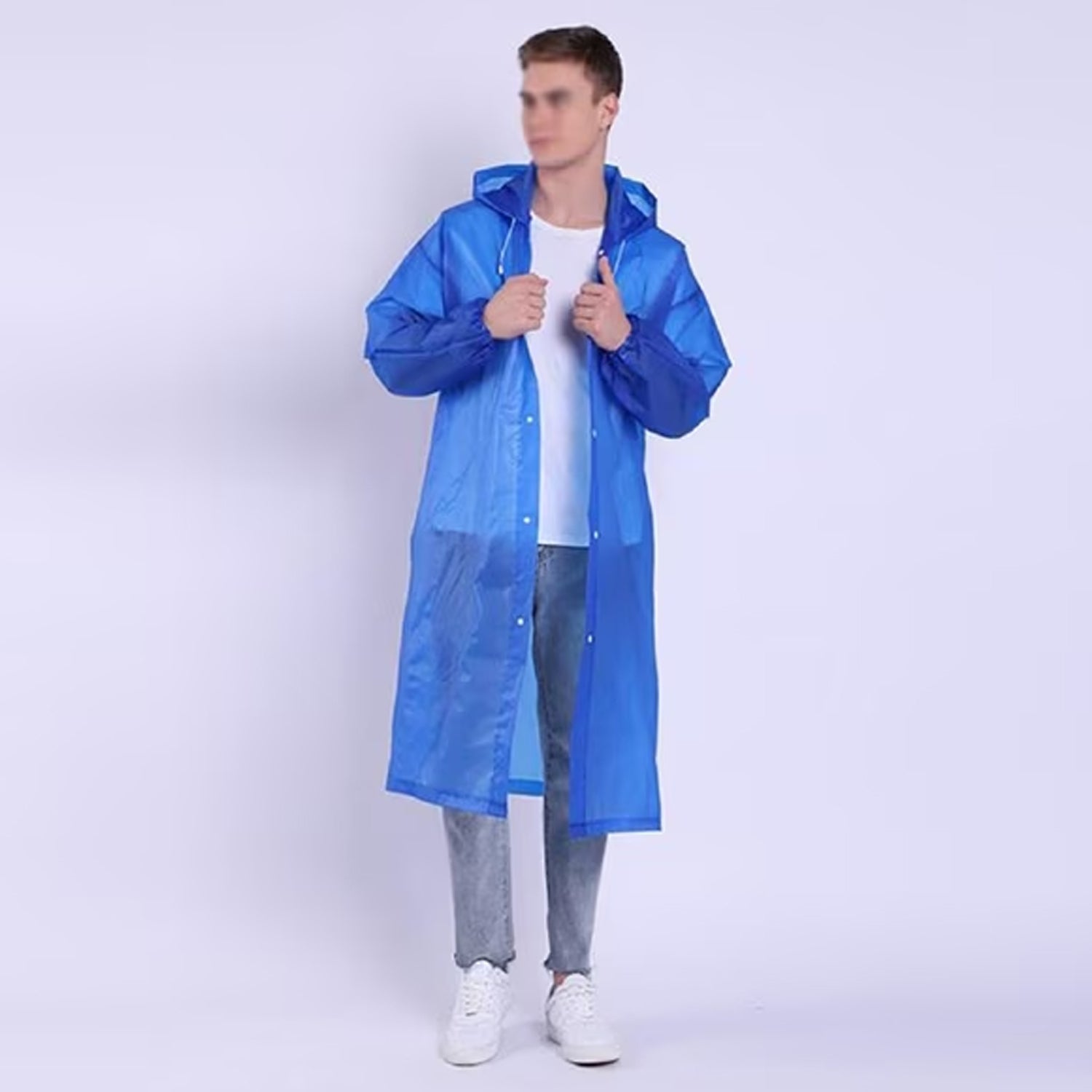 A man in a blue translucent rain jacket with a hood stands facing forward, holding the lapels.