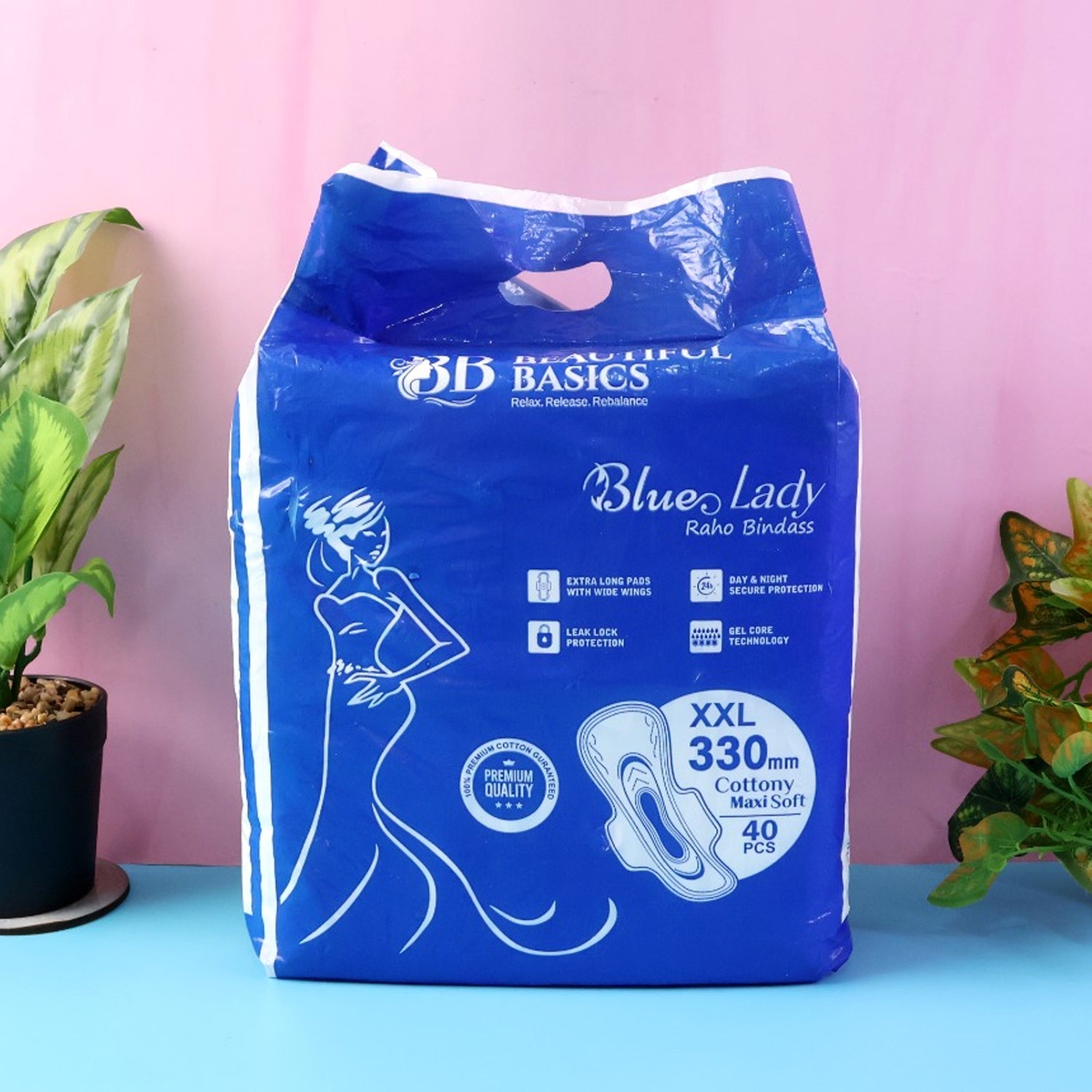 A close-up of a Sanitary Pads 330mm pack, highlighting the 'Blue Lady' branding and 'Extra Long' feature.