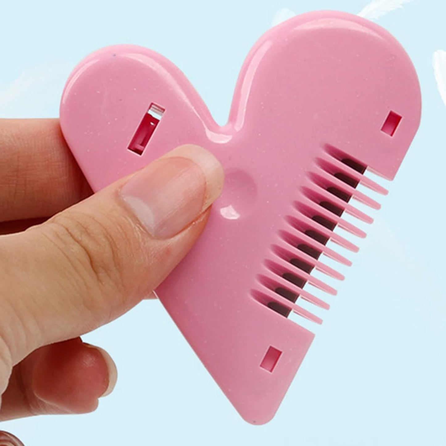 Lightweight baby hair scissors held in hand, demonstrating ease of use.