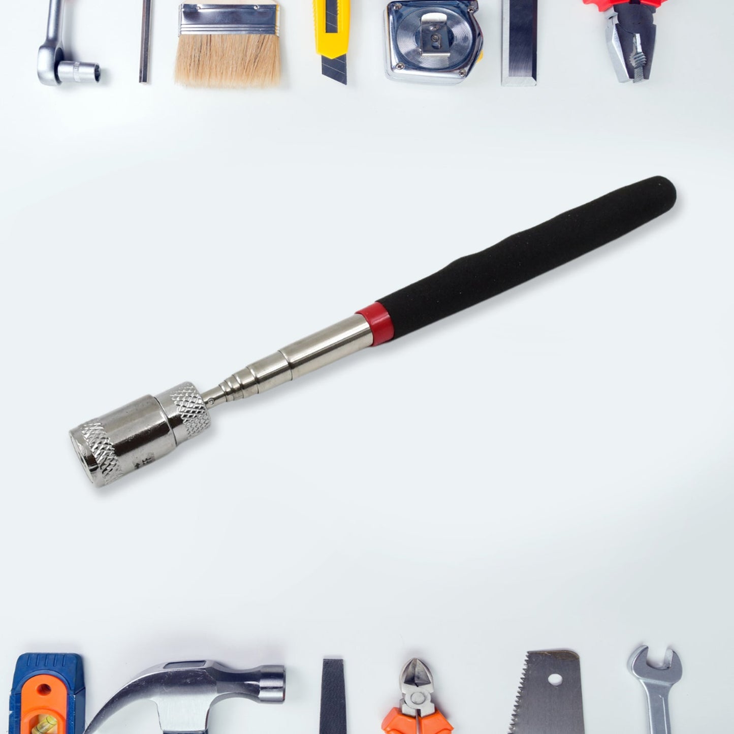 Portable magnetic grabber tool used to retrieve a dropped nut.