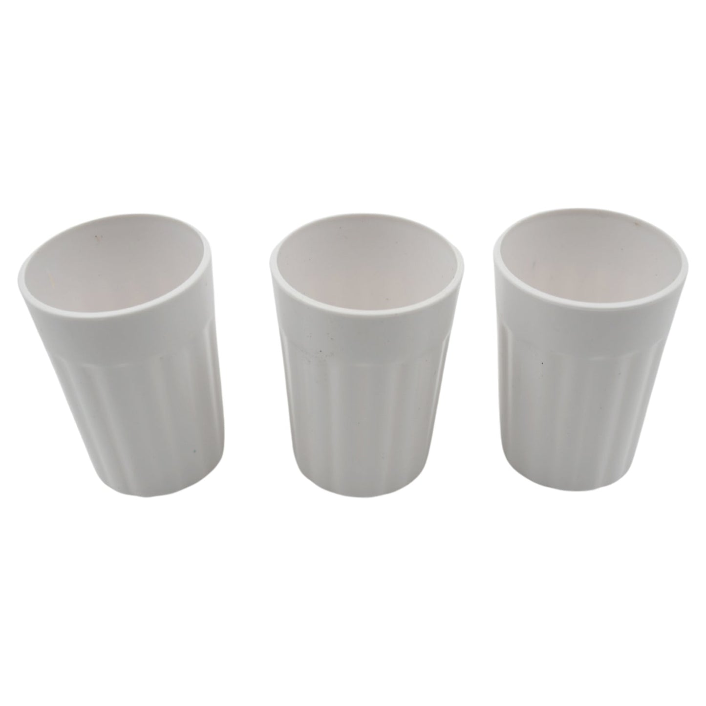 Multiple small plastic coffee and tea cups arranged for display.