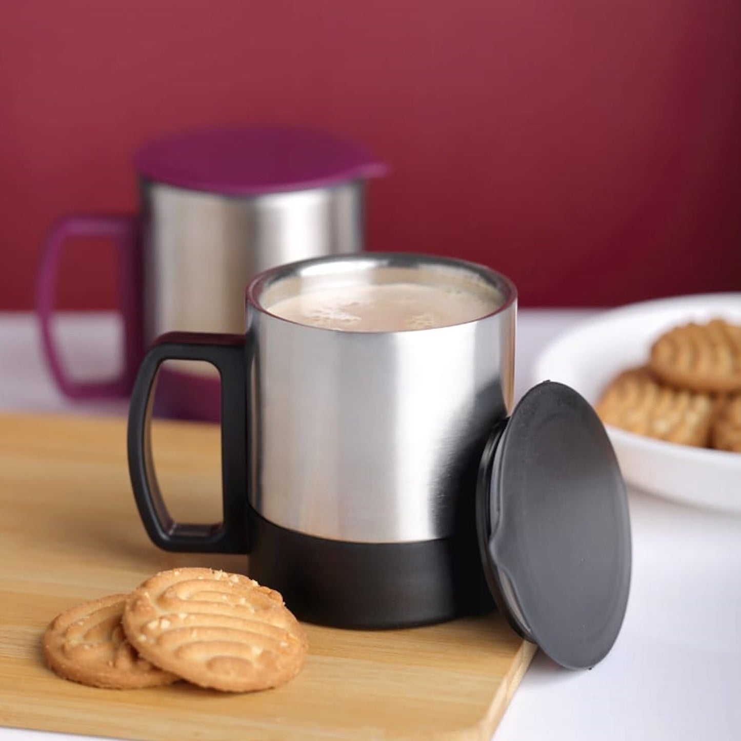 Side view of the durable stainless steel coffee mug with a comfortable handle.