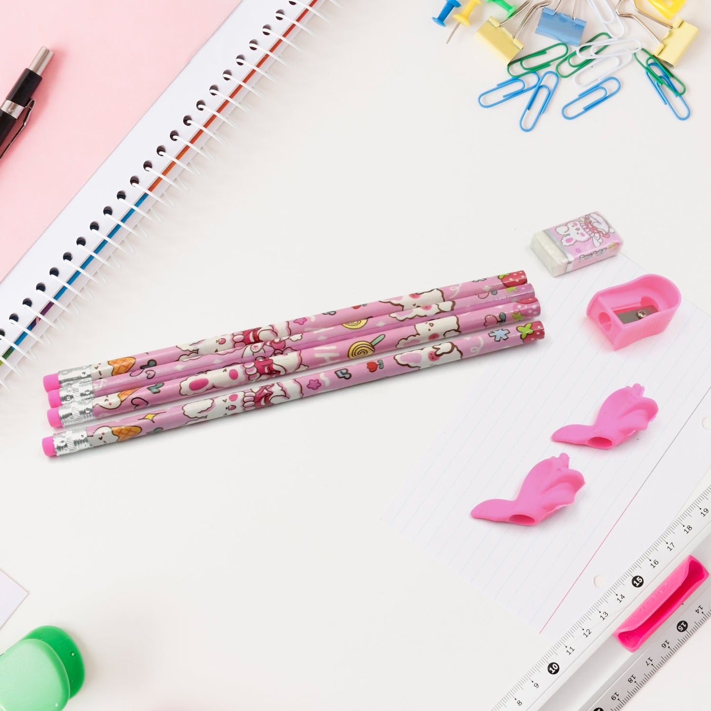 Vibrant erasers and a sharpener included in the kids' stationery kit.