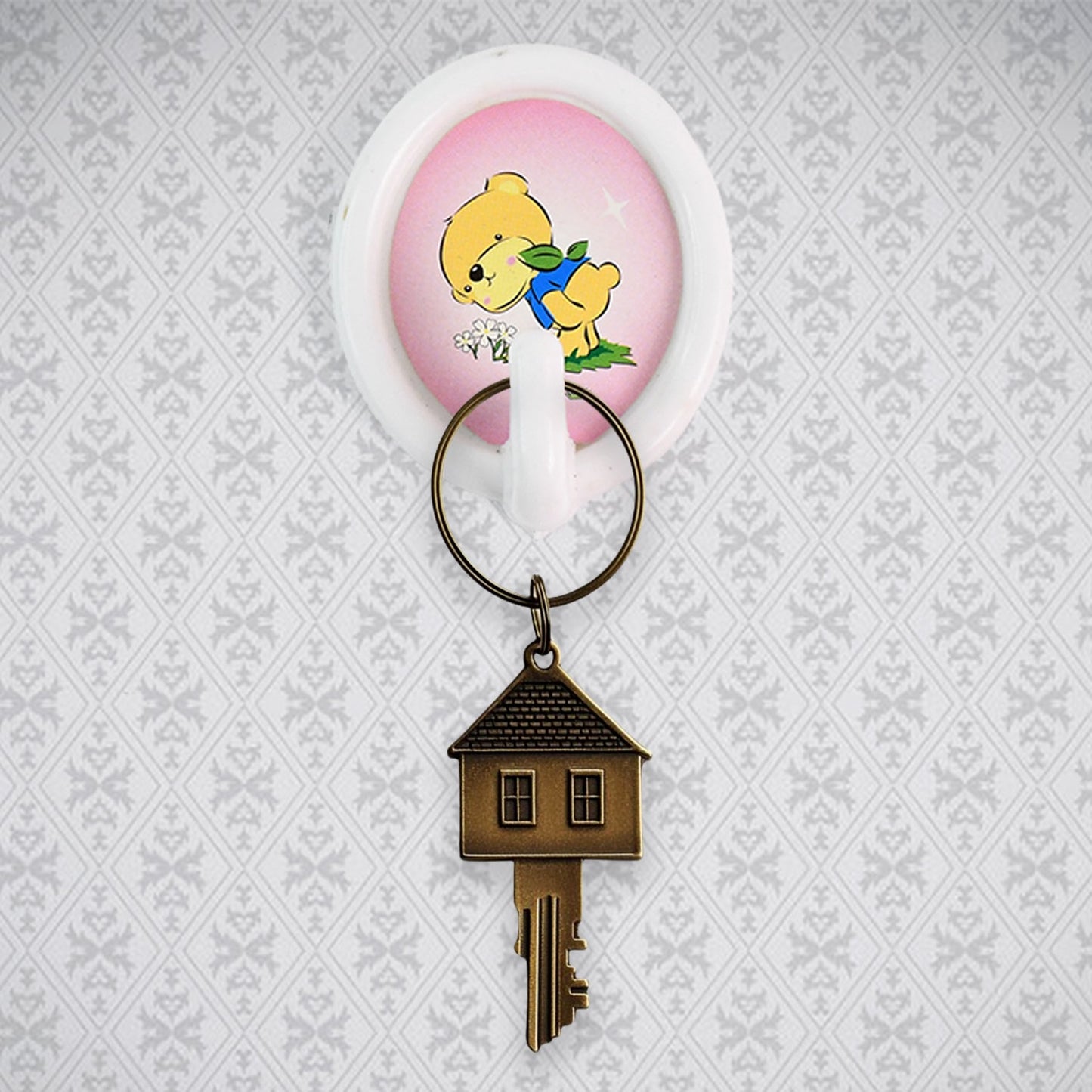 A smiley wall hook holding a kitchen ladle, demonstrating its functionality in a modern kitchen setting.