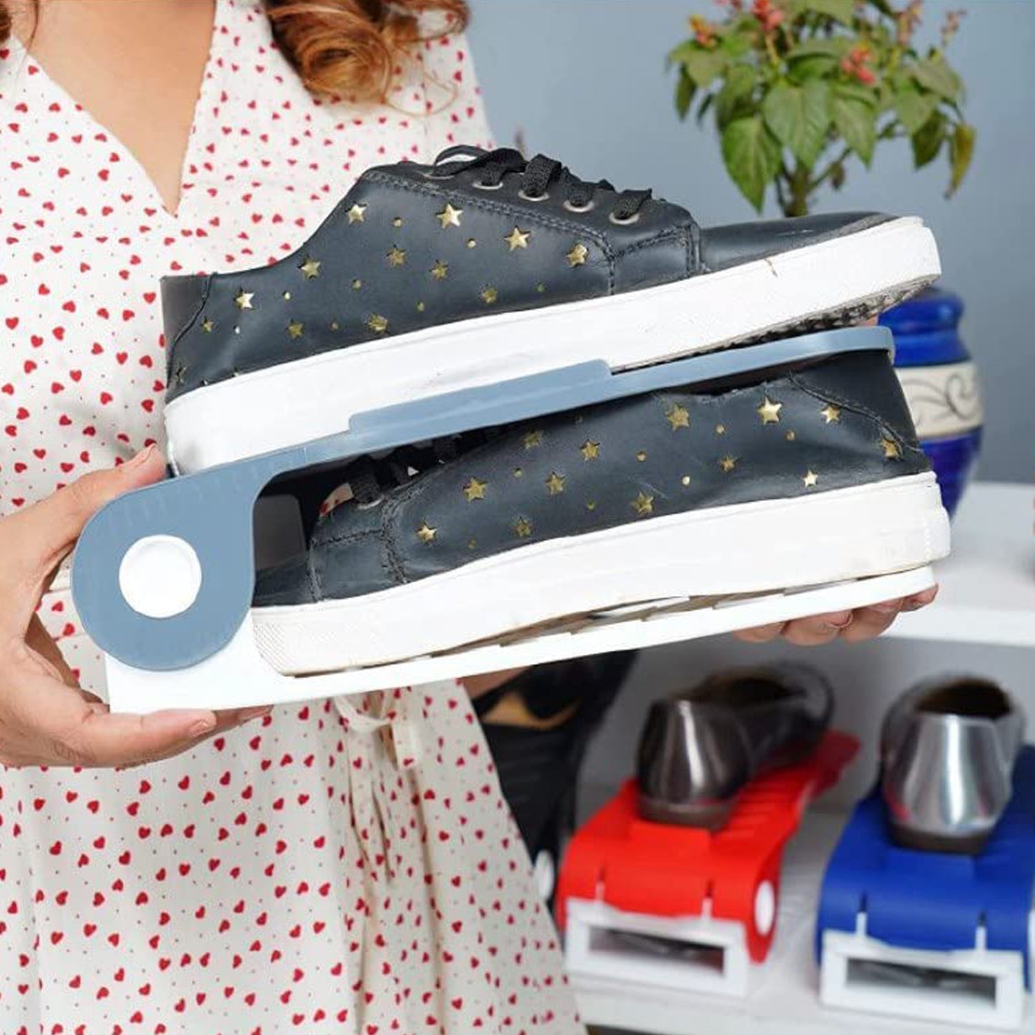 Multiple adjustable shoe organizers arranged in a closet, creating a tidy and organized shoe collection.