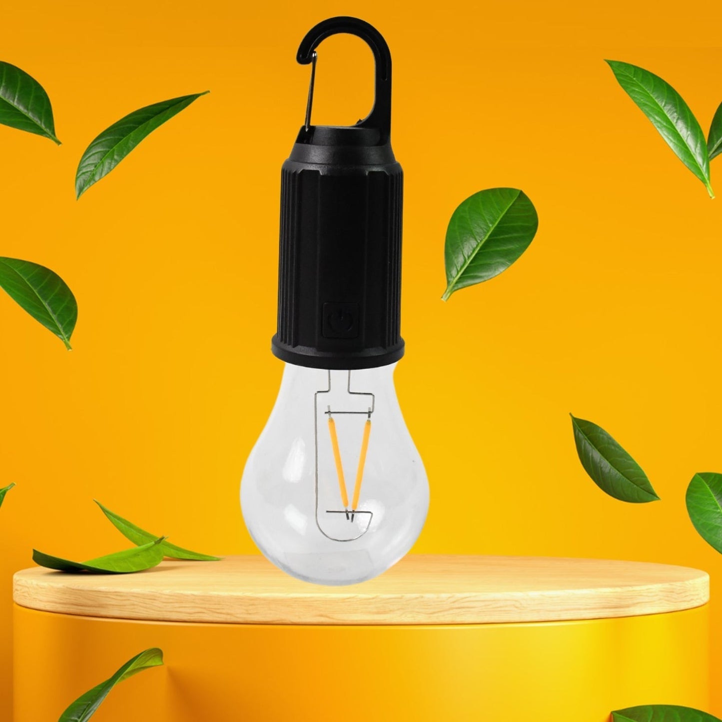 A black and clear portable LED tent light with an orange filament stands on a light wooden pedestal against a bright yellow