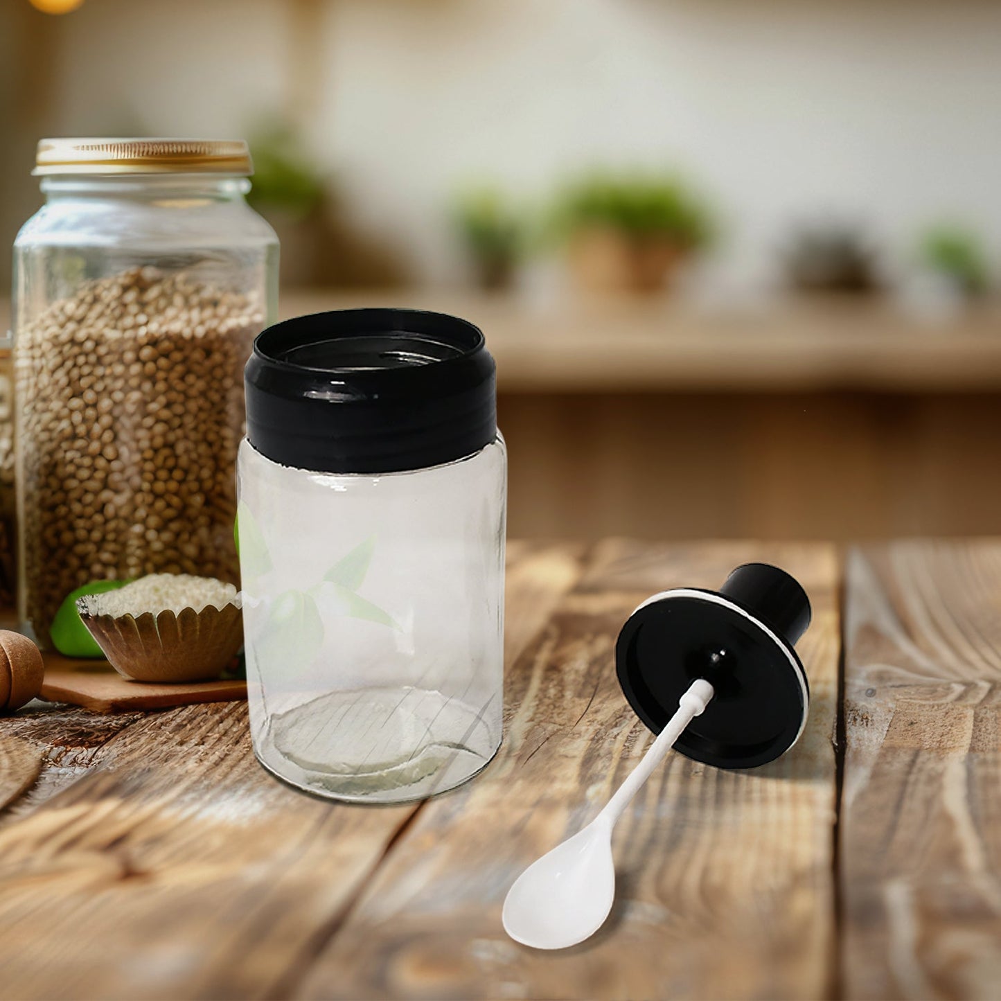 glass oil dispensers and spice jars neatly arranged in a modern kitchen.