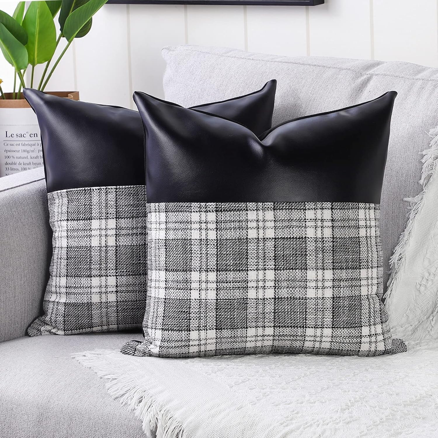 Close-up of a pair of Styleva Leather & Cotton Pillow Covers with elegant texture.