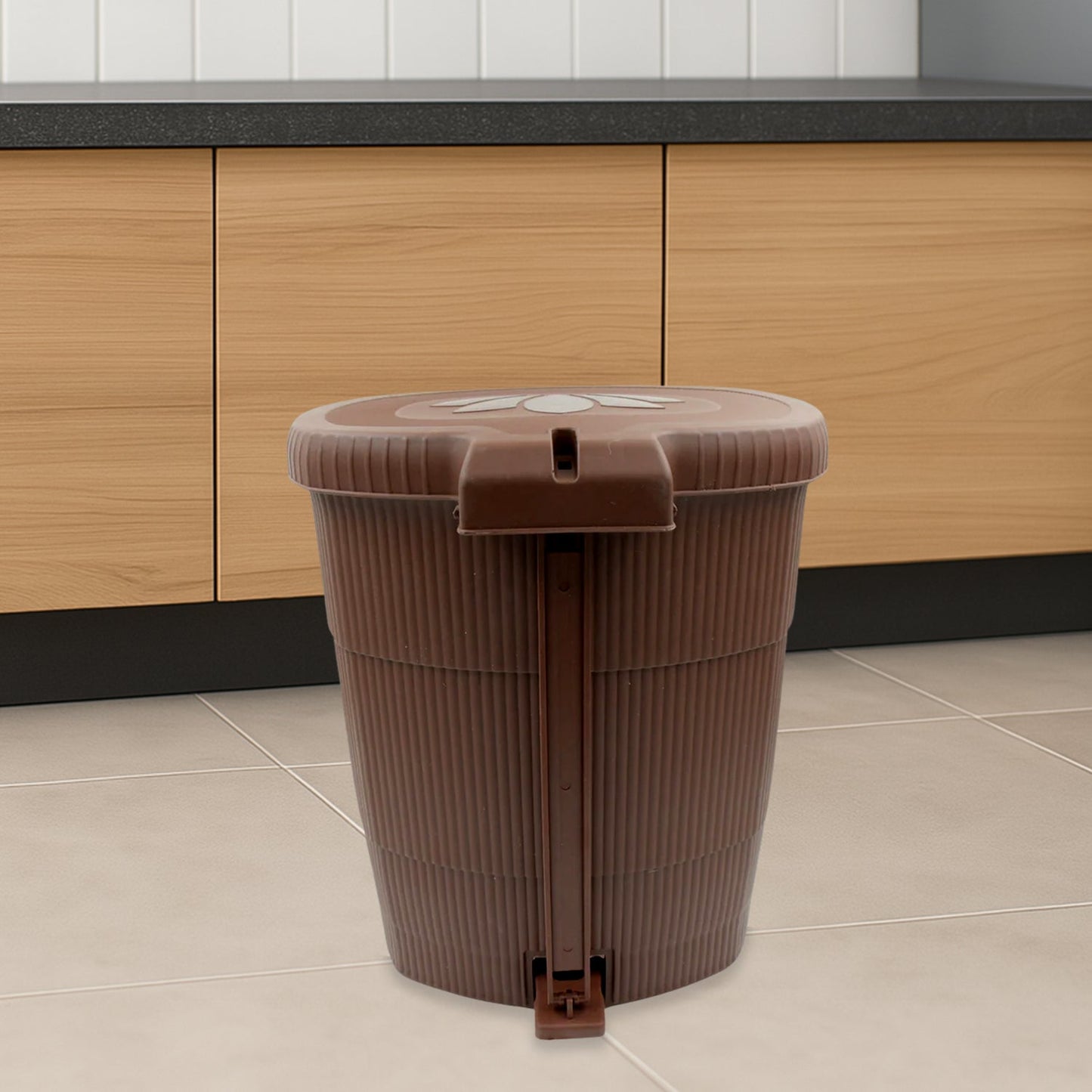 Side view of a white mini pedal dustbin, highlighting its convenient foot pedal.