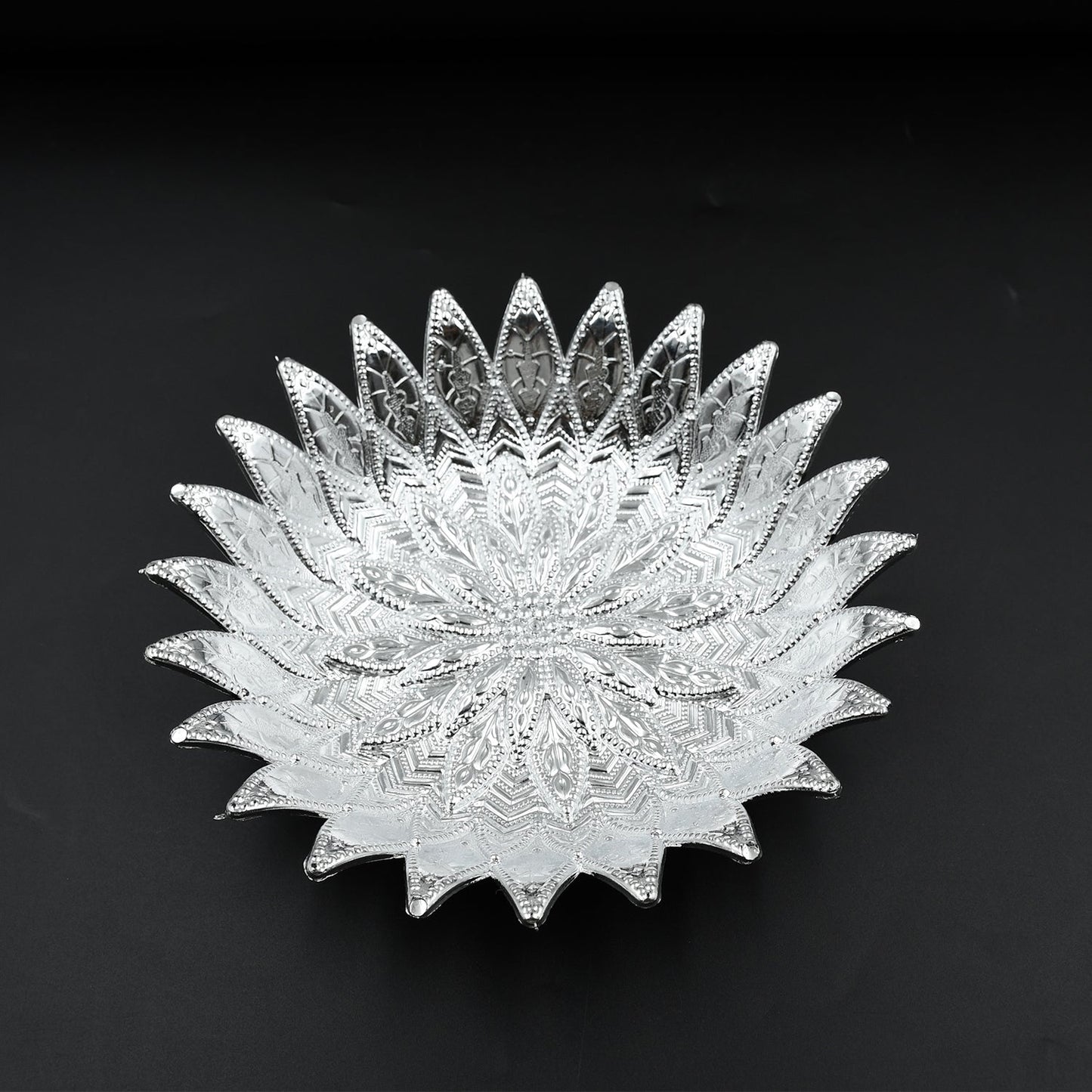 Multipurpose silver finish tray showcasing dry fruits, ideal for festive gatherings.