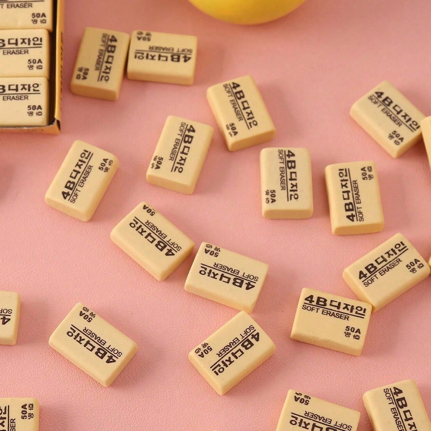 A rectangular bright yellow 4B eraser ready for school or office tasks.