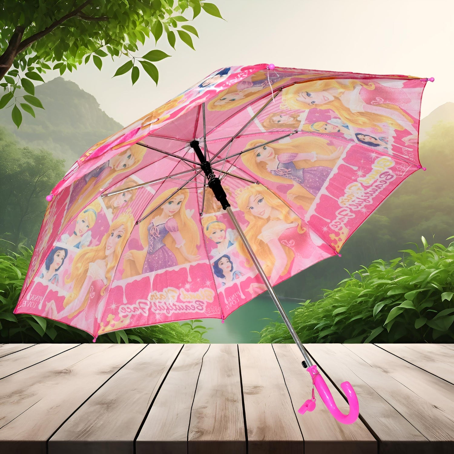 A pink umbrella with princess characters is open on a wooden surface, with a lush green forest and mountains in the