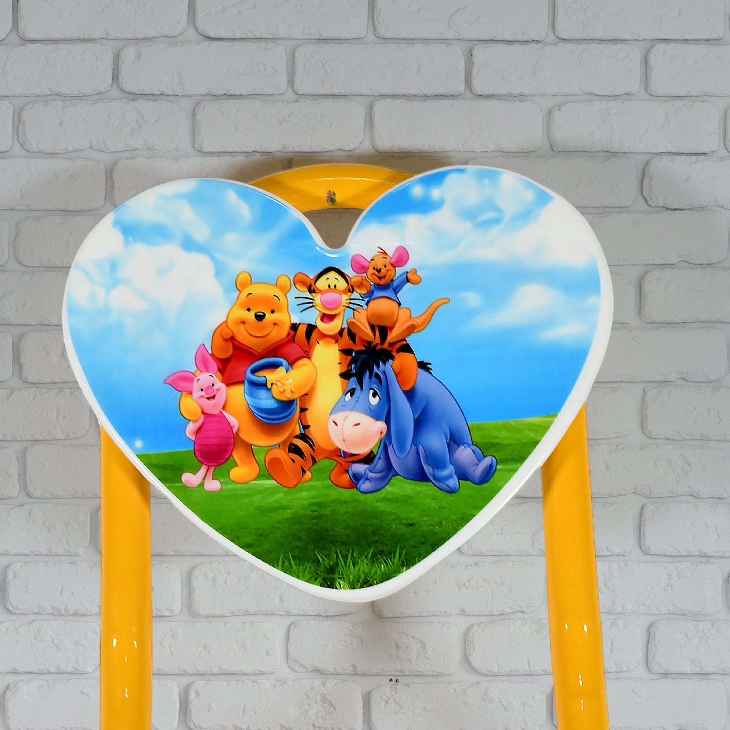 Back view of the heart-shaped children's chair, emphasizing its comfortable design.