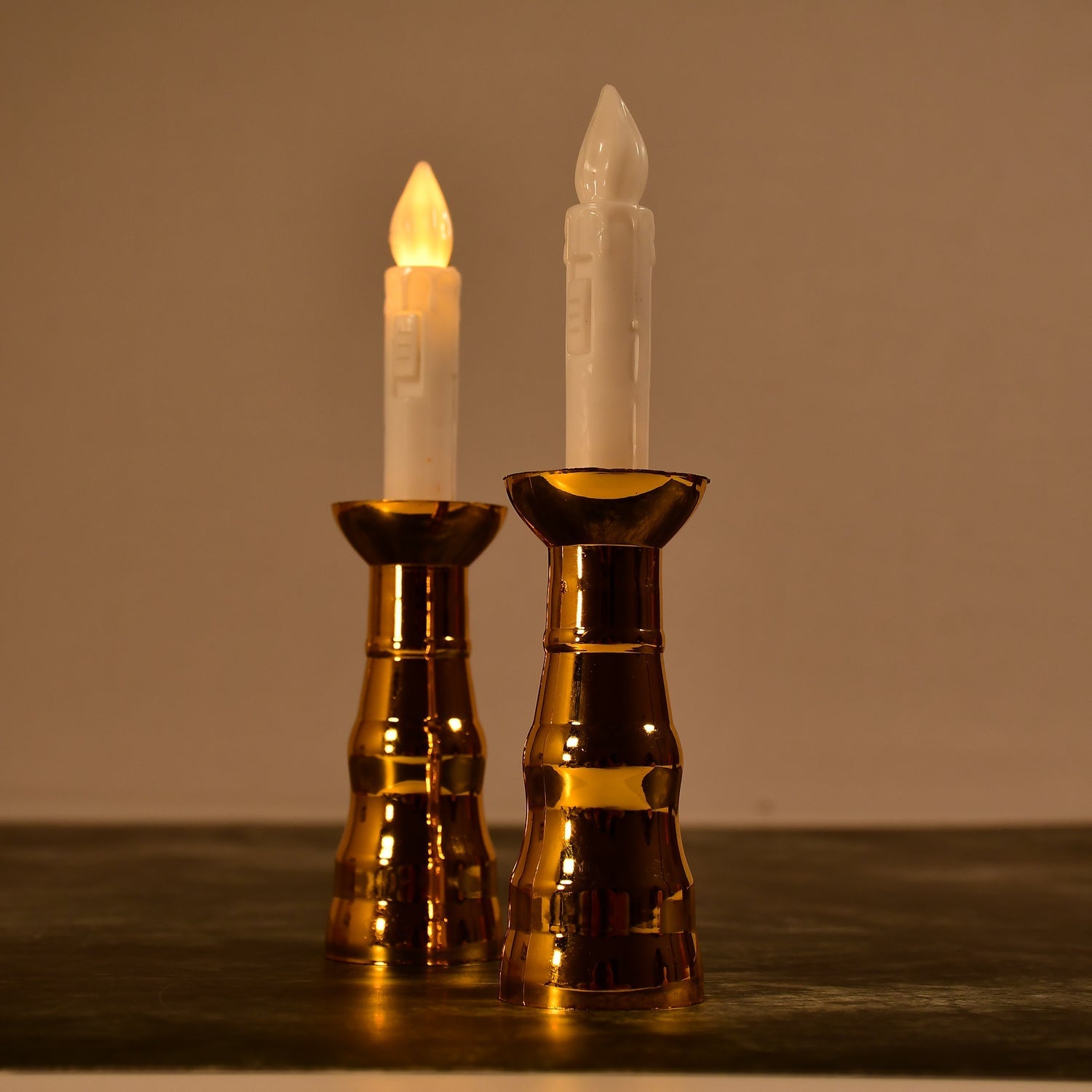 A pair of decorative flameless LED candle lights creating a warm ambiance.