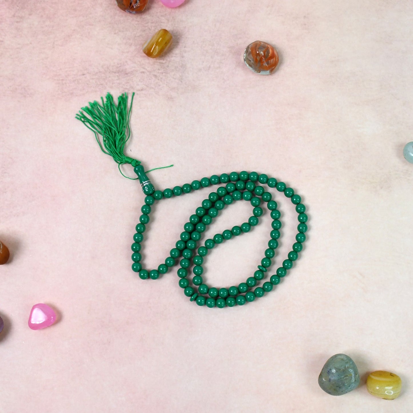 A hand holding Muslim prayer beads, ready for zikr and meditation.