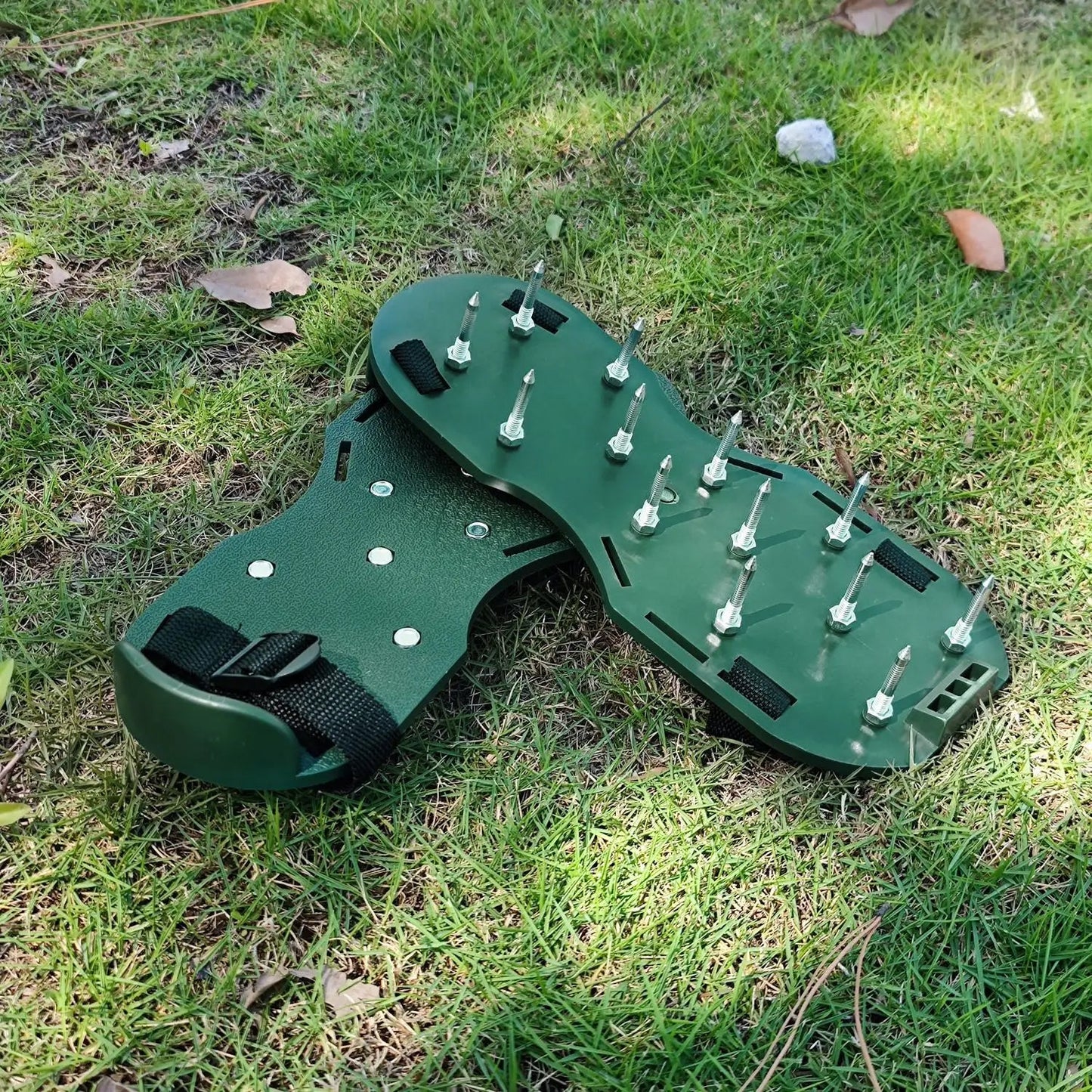 Close-up of the durable steel spikes on the Lawn Aerator Sandals for effective grass aeration.