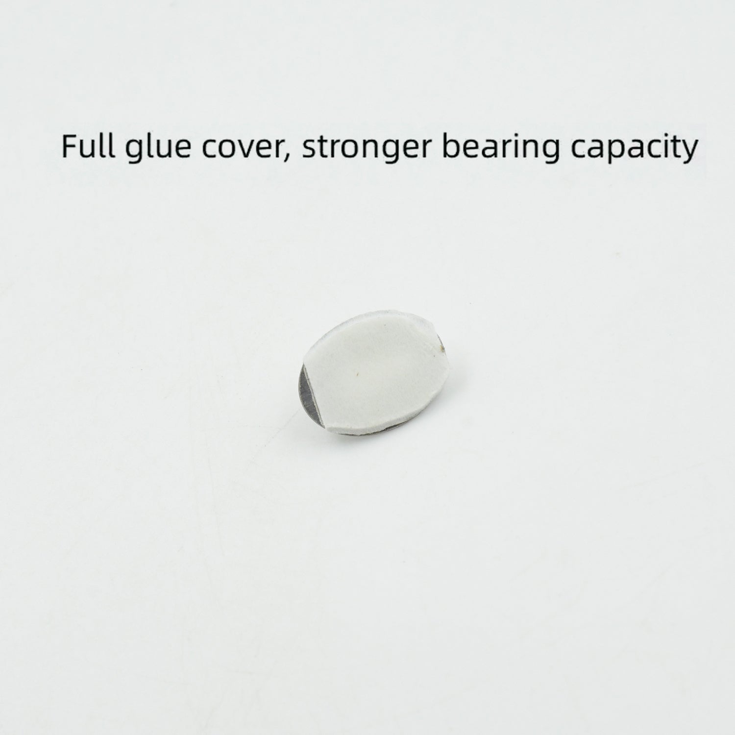 A single capsule-shaped stainless steel hook demonstrating its strong adhesive backing.