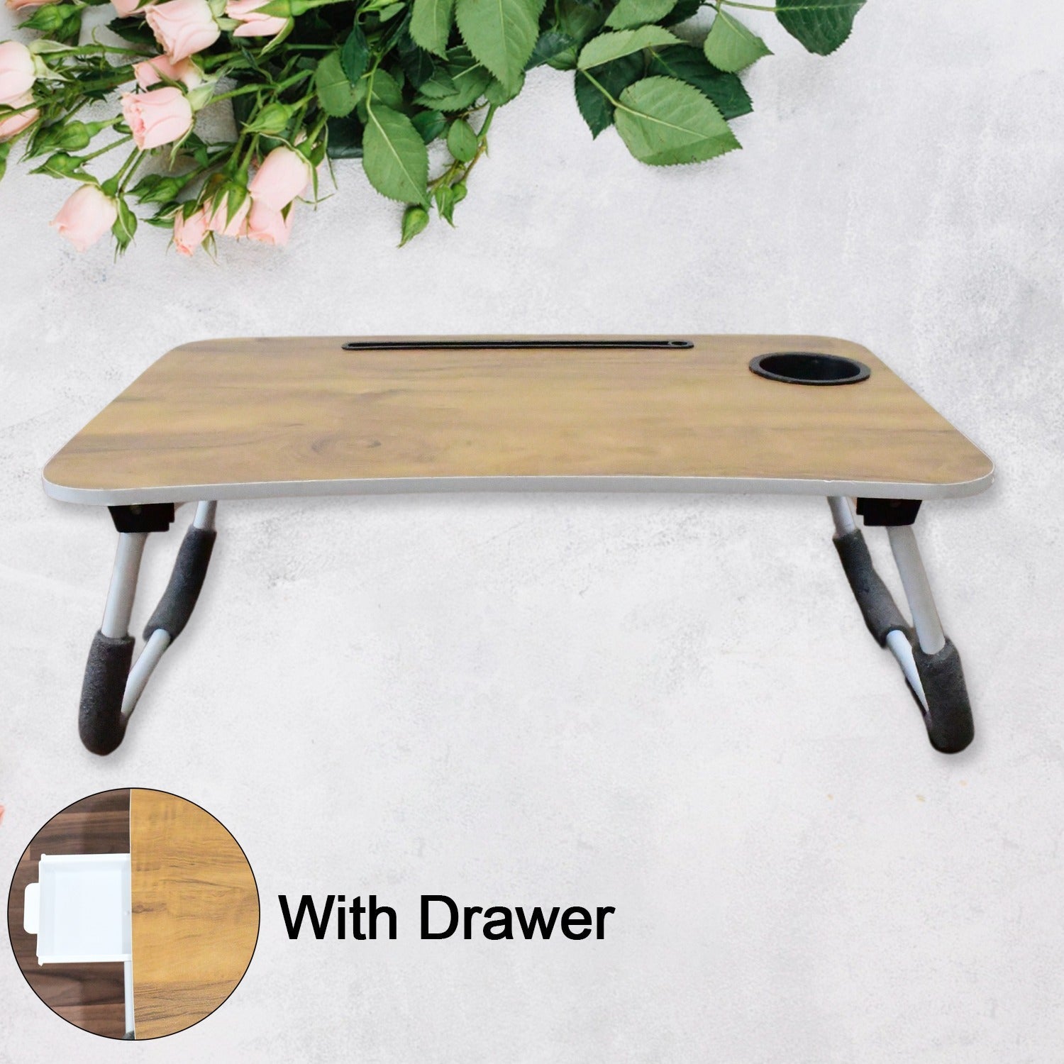 foldable laptop table used for studying with books and a tablet, highlighting its versatility.