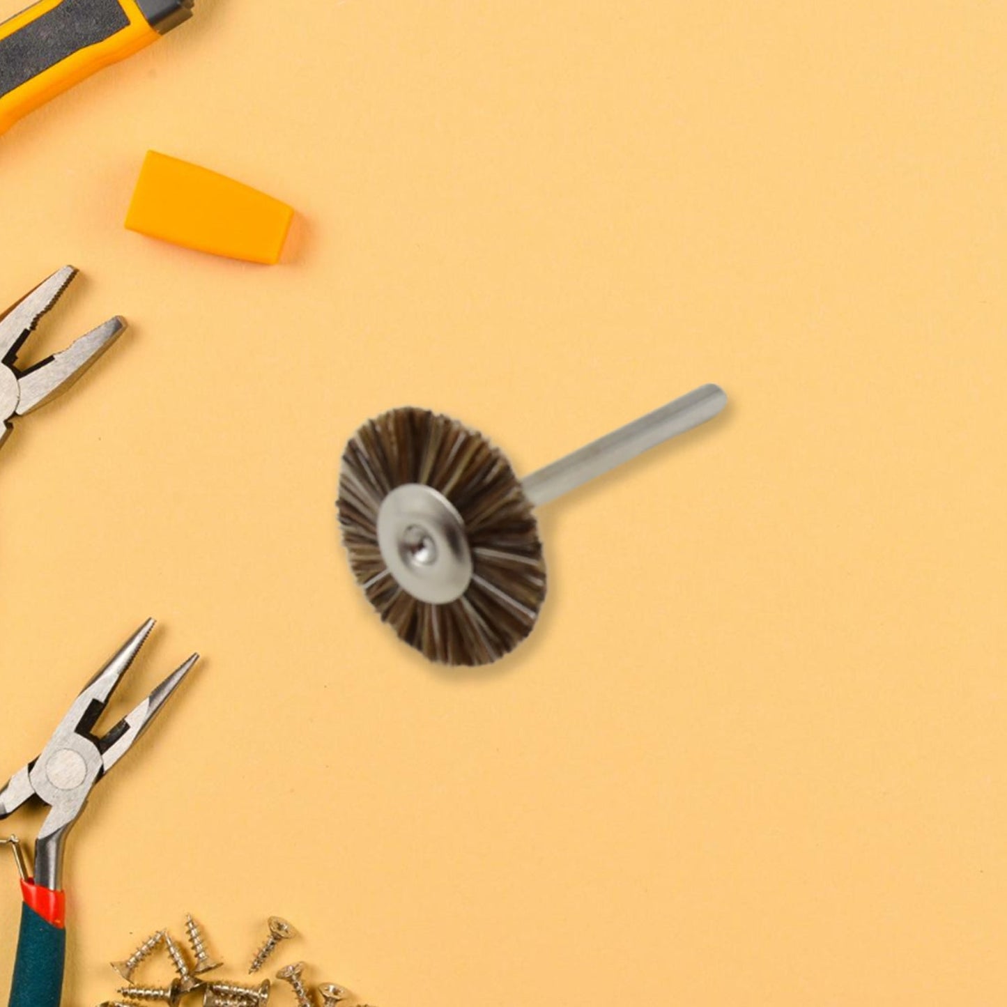 A shank-mounted brass wire brush, ideal as a drill attachment for metal grinding.