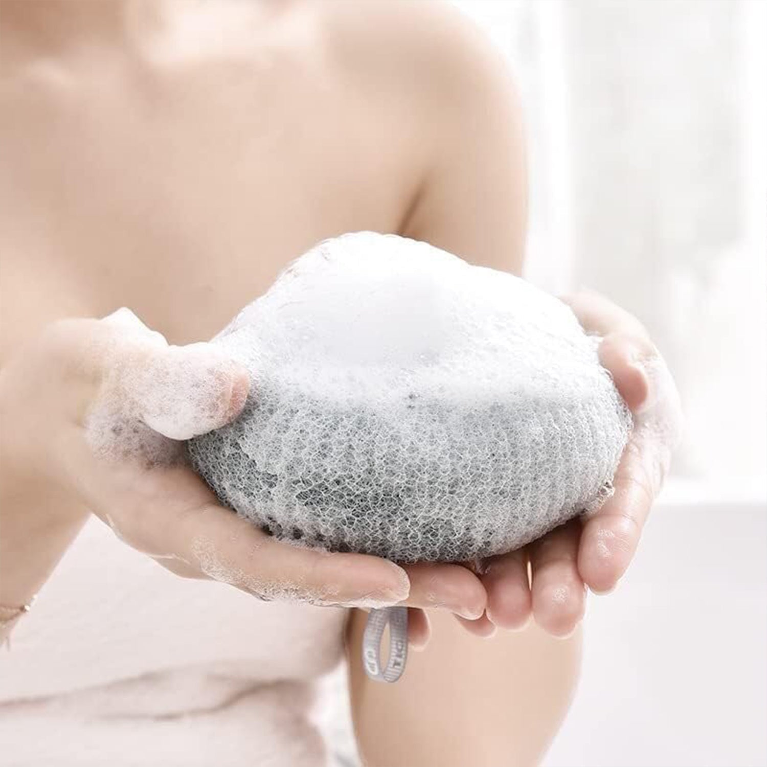 Detailed view of the super soft texture of the flower bath sponge.