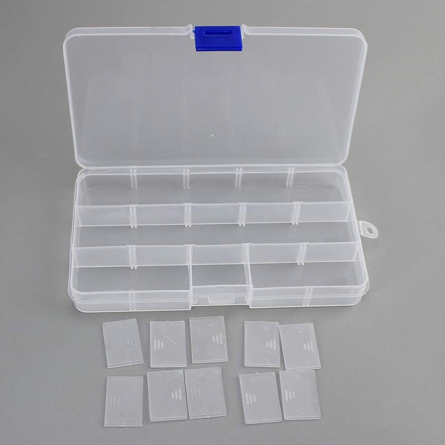 Compact and portable 15-grid plastic organiser for rings, earrings, and small trinkets.