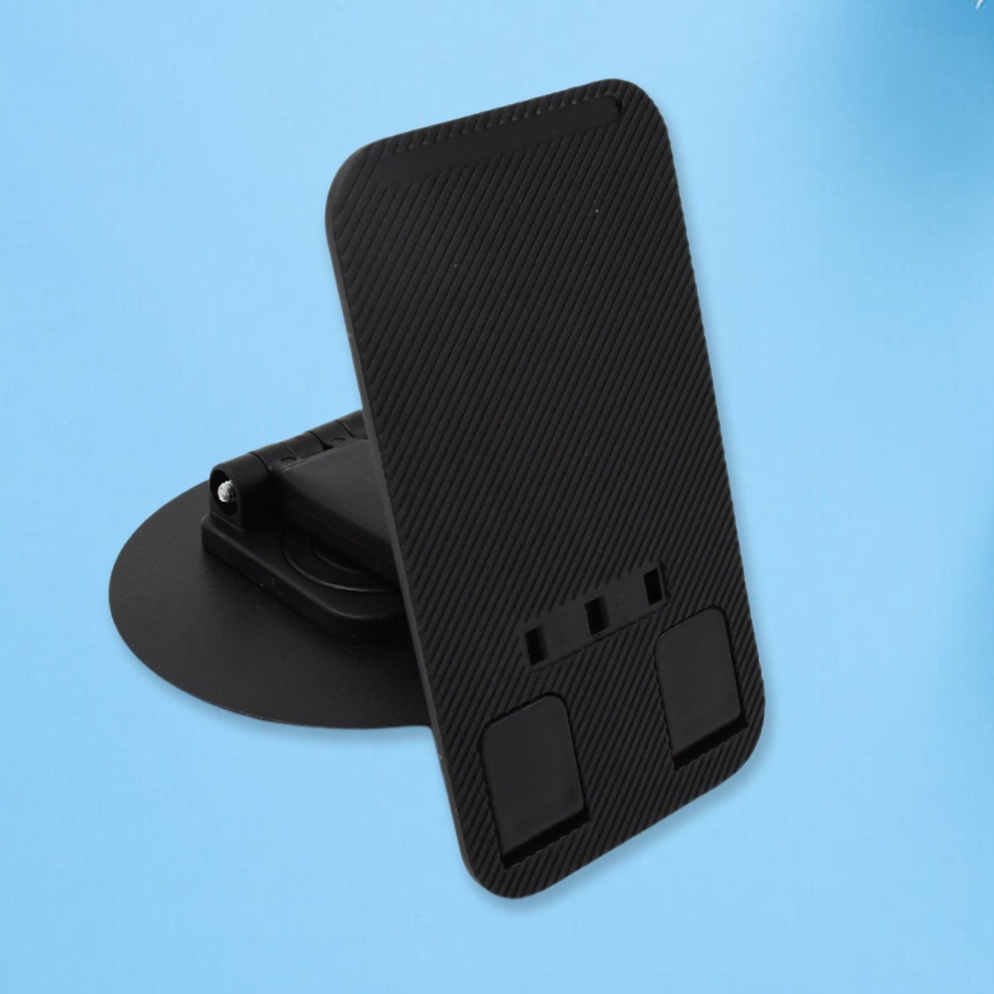 Top-down view of the rotating mobile stand in use, showcasing its 360-degree swivel feature with a phone.