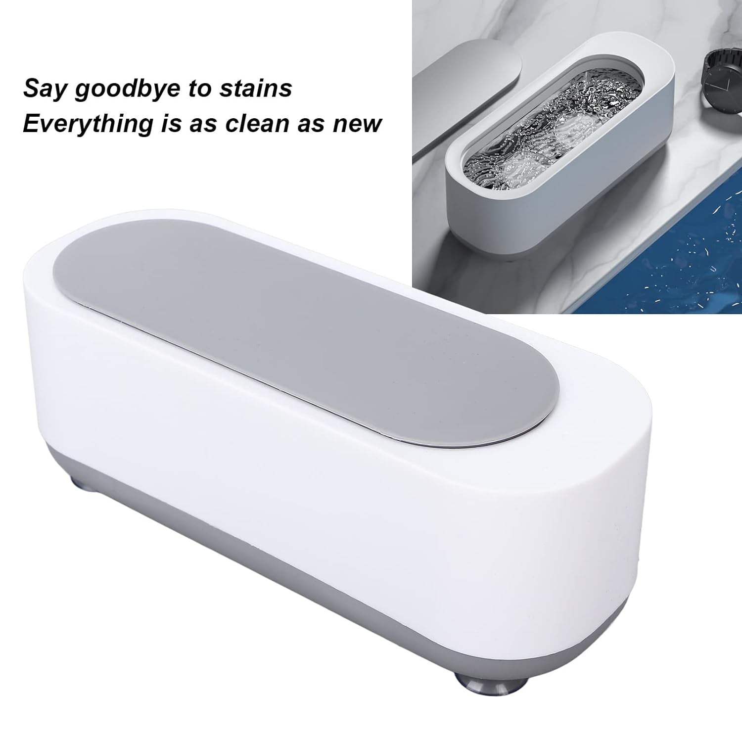 Compact ultrasonic cleaner with a sparkling ring and earrings inside after cleaning.
