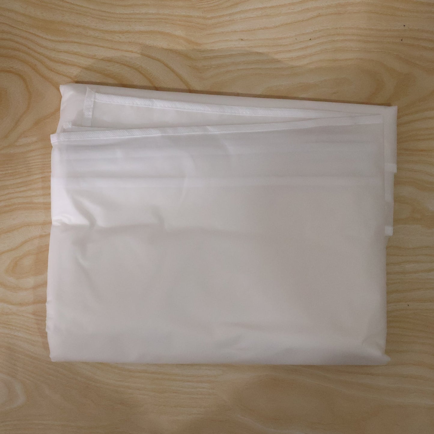 Space-efficient foldable suit cover, ideal for travel and compact storage.