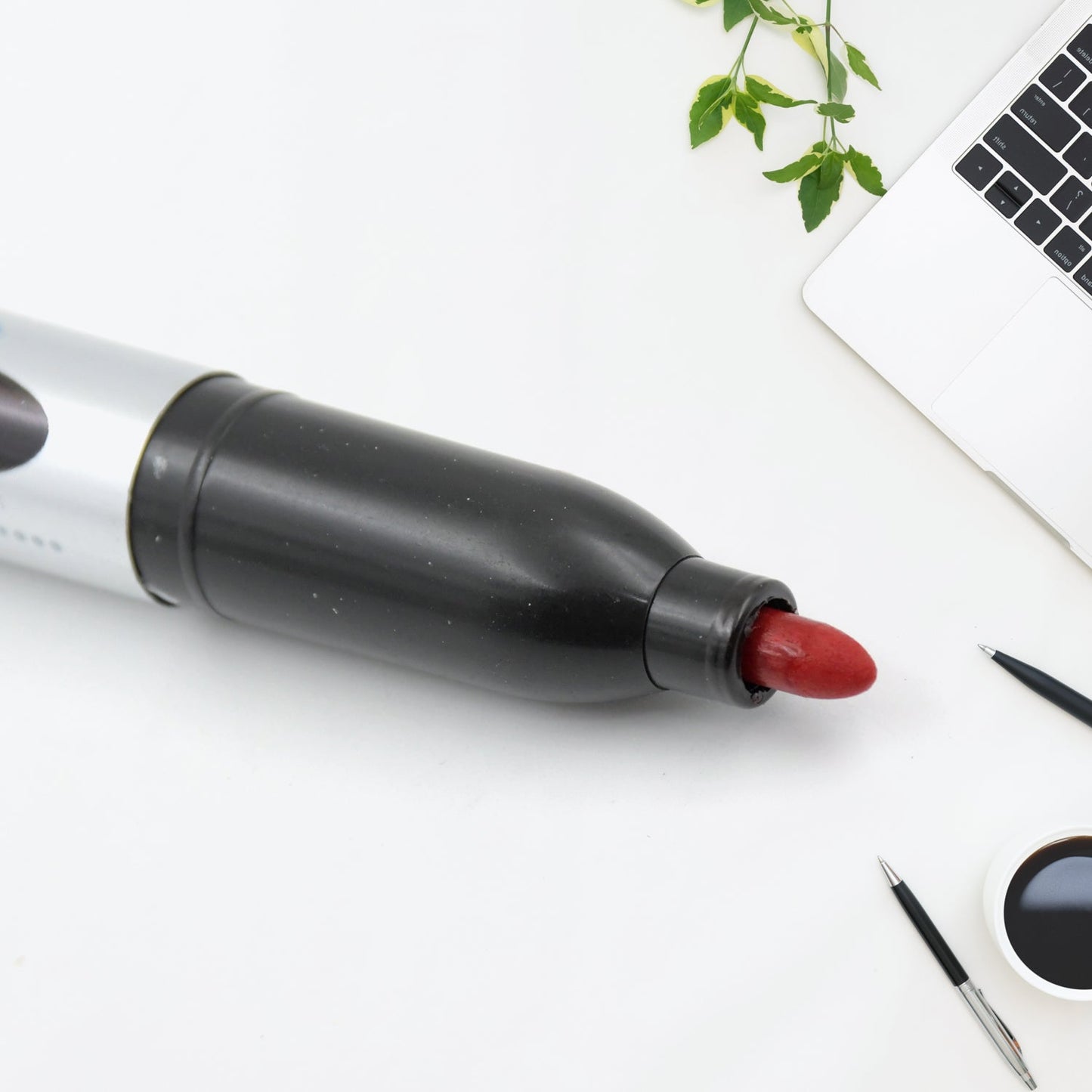 Packaging of the 10-piece maroon permanent marker set.
