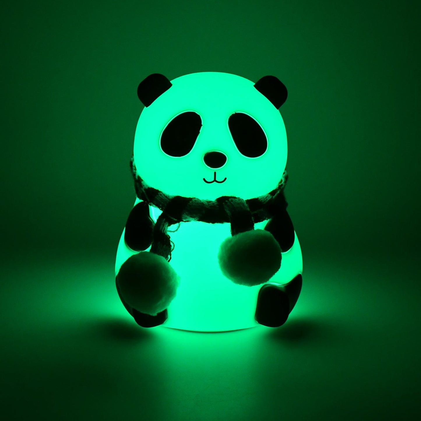 Side view of the charming panda night light, showcasing its smooth silicone texture.