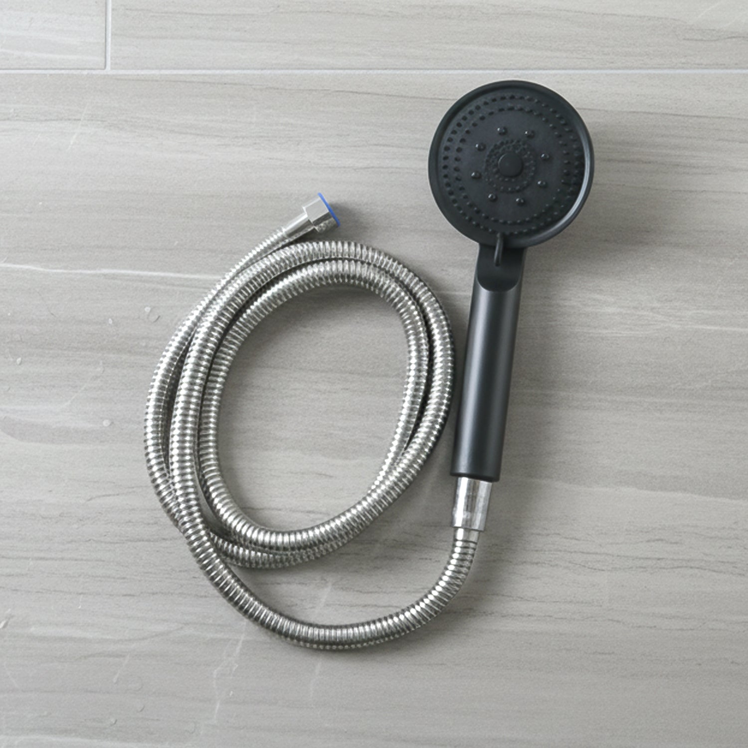 Flexible stainless steel hose connected to shower handle shower head