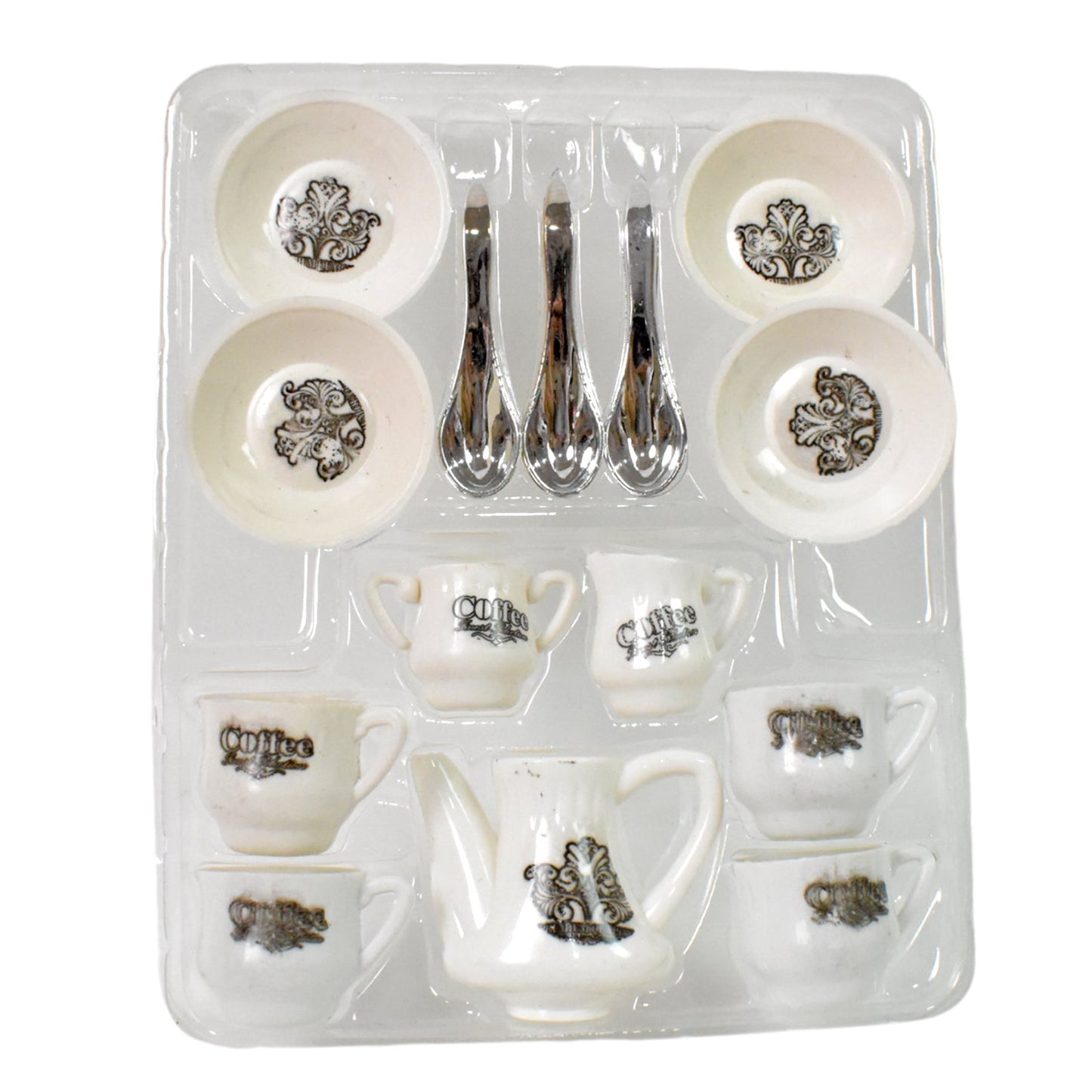 Detailed shot of the miniature plastic serving tray and tea pot.