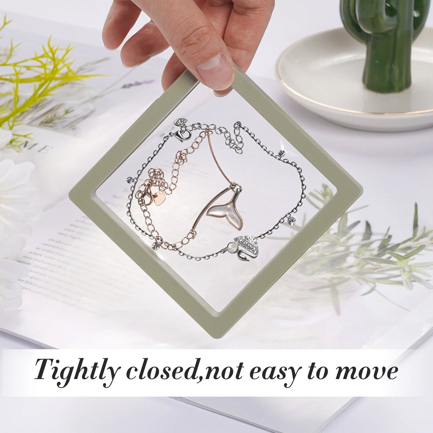 Transparent Floating Jewelry Display Box with a pearl necklace and stud earrings.