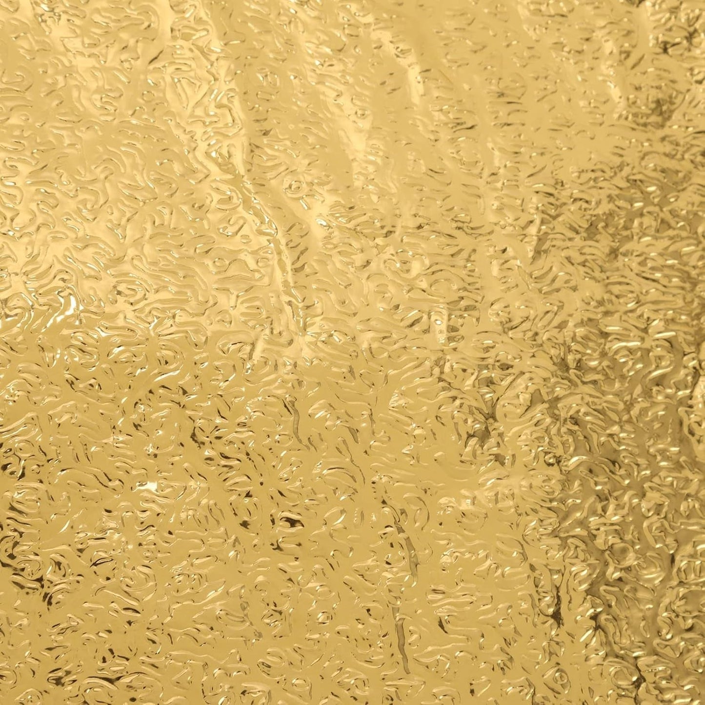 Close-up of a self-adhesive golden kitchen foil sticker roll.