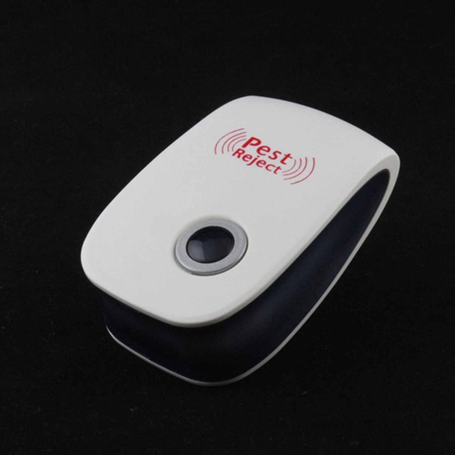 A white and black pest repeller with a black button is shown on a dark, reflective surface.