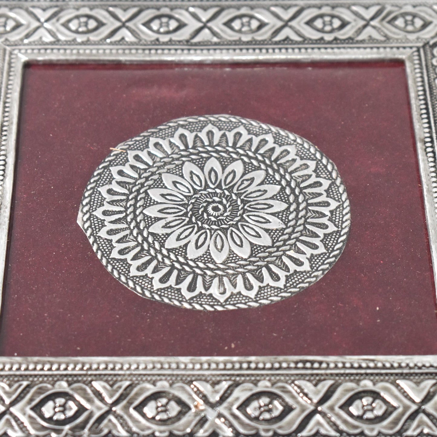 Top view of the silver pooja chowki, showcasing its exquisite mandala pattern and finish.