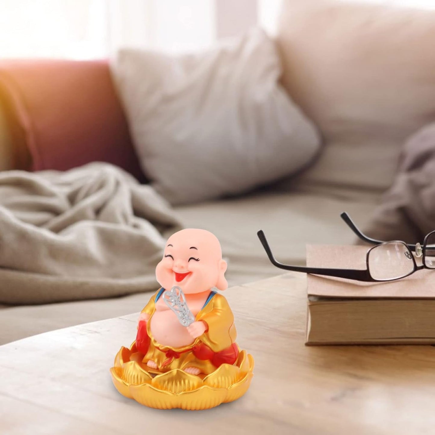 The peaceful expression of the Solar Buddha Car Ornament, ideal for dashboard decoration.