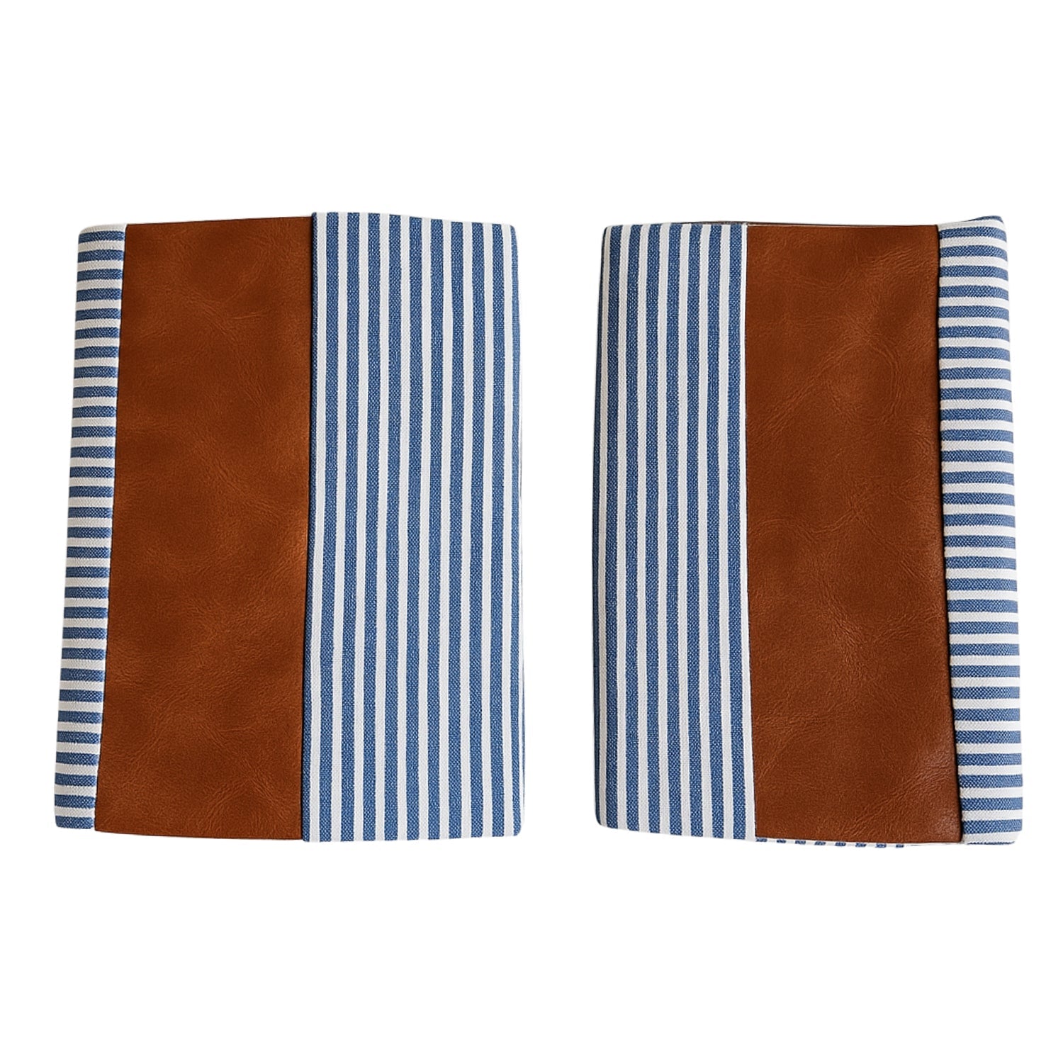 Pair of leather and cotton pillow covers on a modern sofa