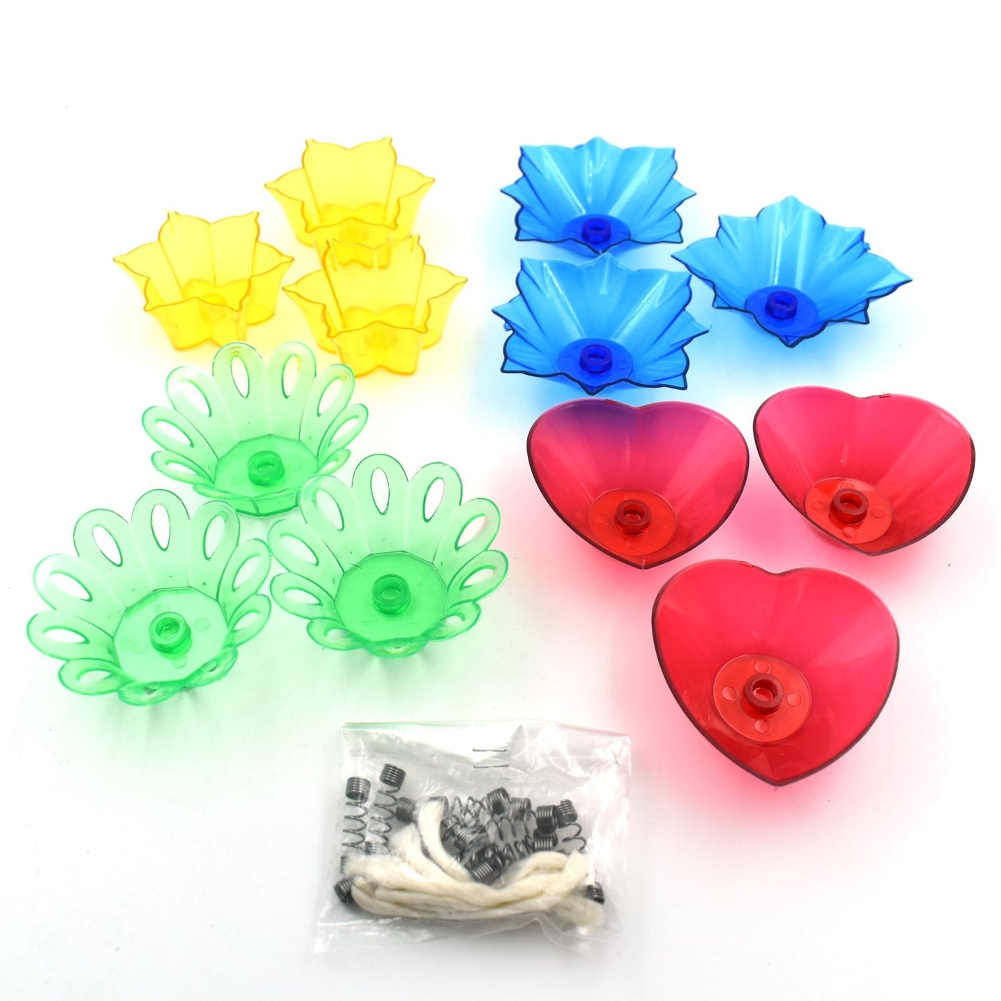 Assorted multicolor candle holders arranged for home decoration.
