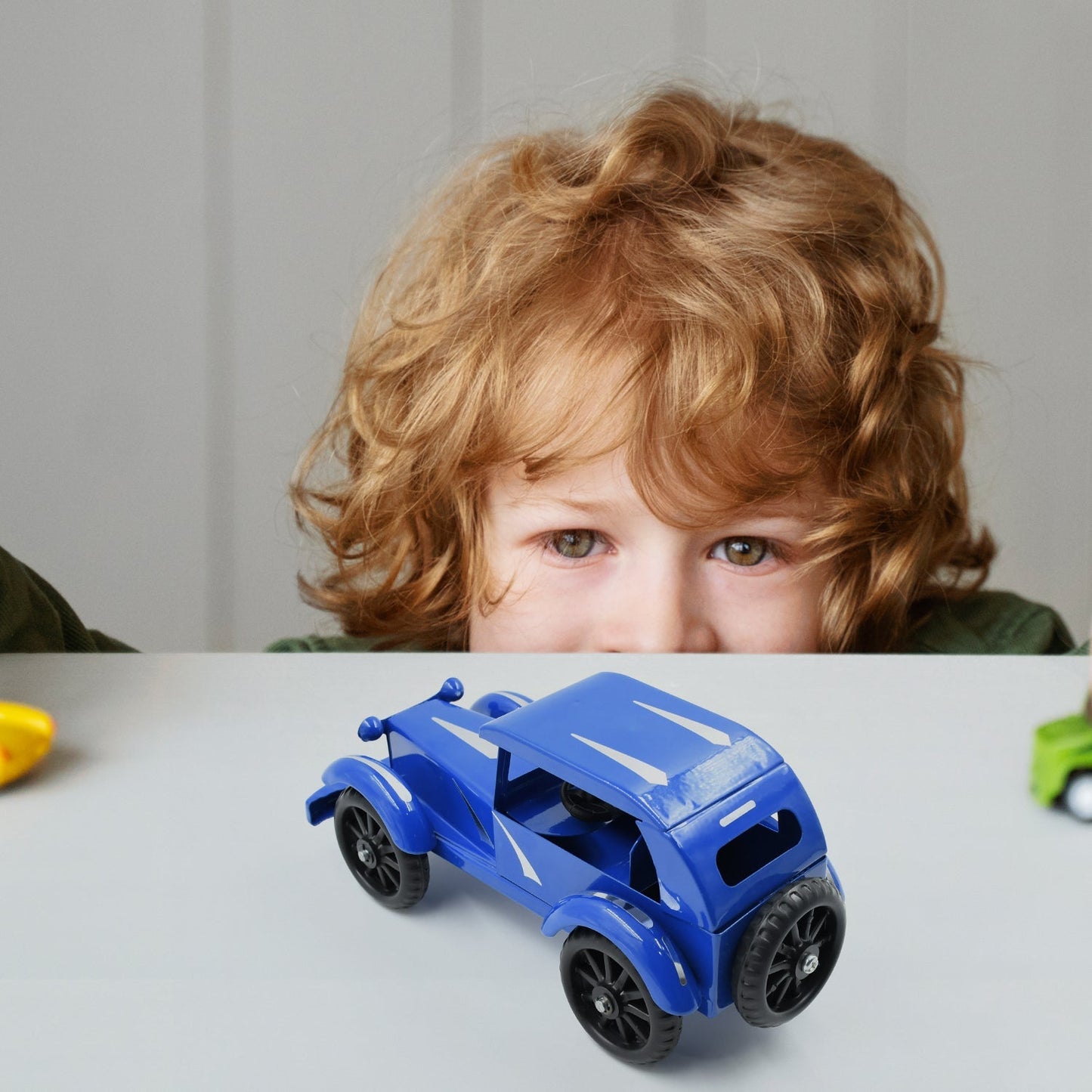 Detailed shot of the Vintage Metal Car's wheels and chassis.