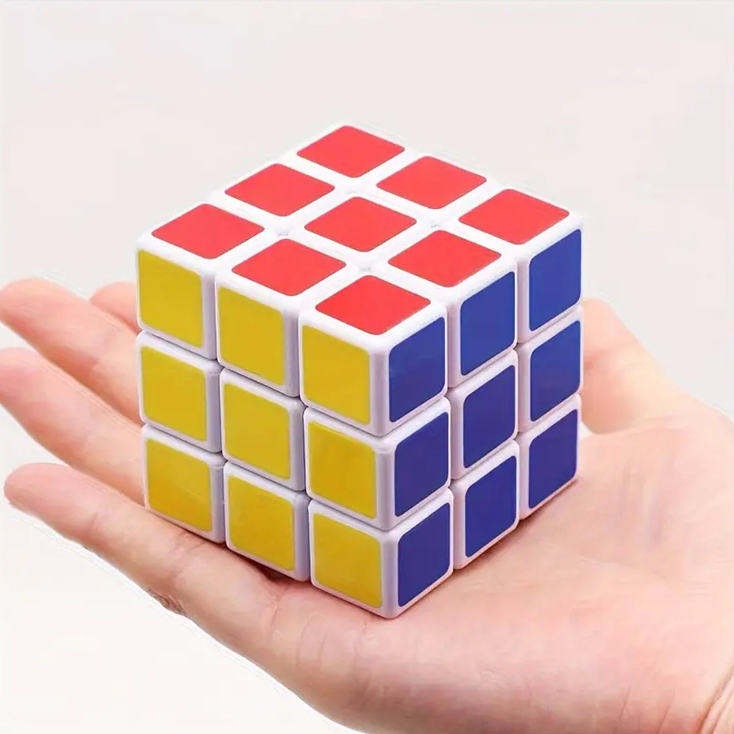 An adult engaging with a Rubik's Cube, using it as a fun brain teaser and stress-relieving logic puzzle.