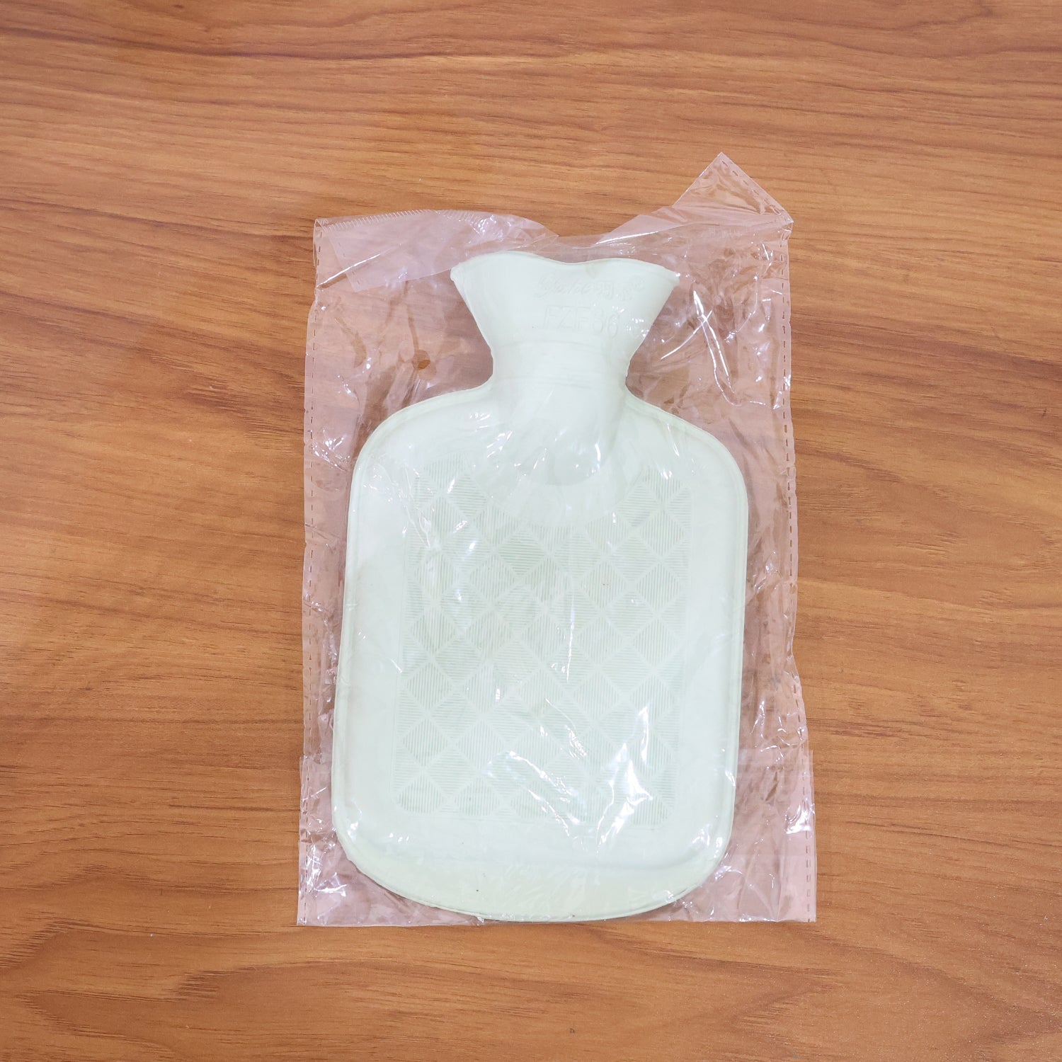 Standard size hot water bag with compact design for convenient heat therapy
